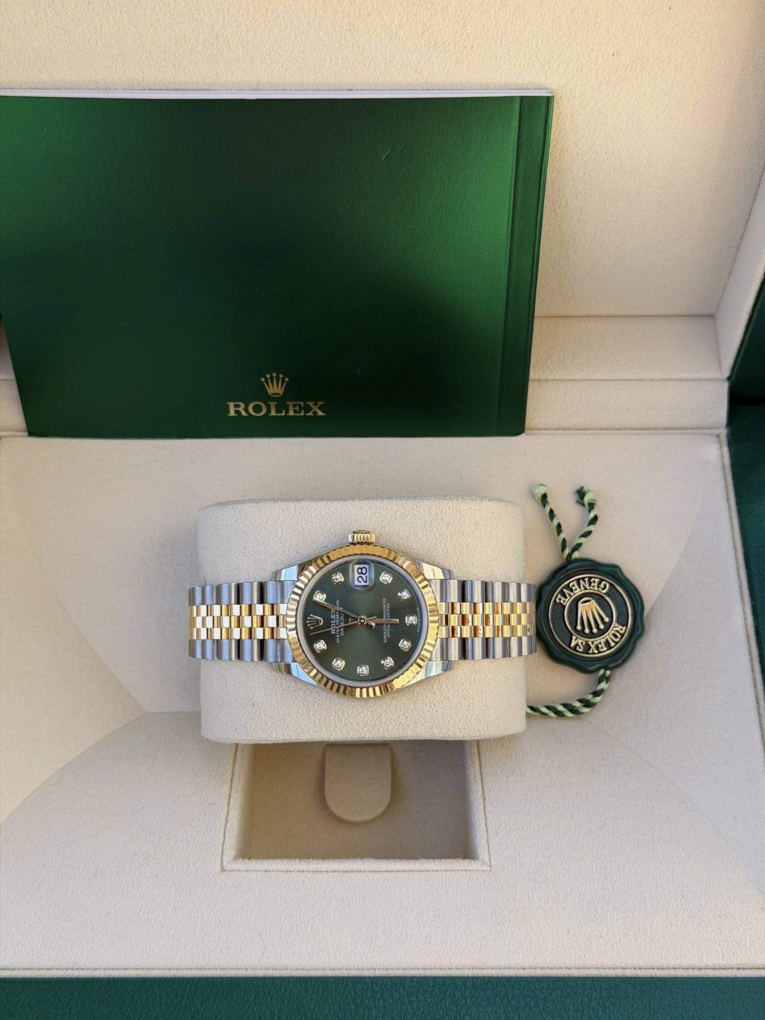 May be an image of wrist watch and text