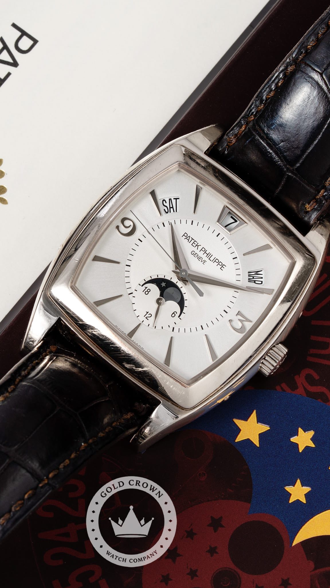 May be an image of wrist watch and text that says 'd ७ SAT 7 PATEK GENEVE PATEKPHILIPPE PHIL PHILIPPE IPPE 18 MAP ل 6 M MUOO GOLD CROWN CROWN WATCH COMPANY'