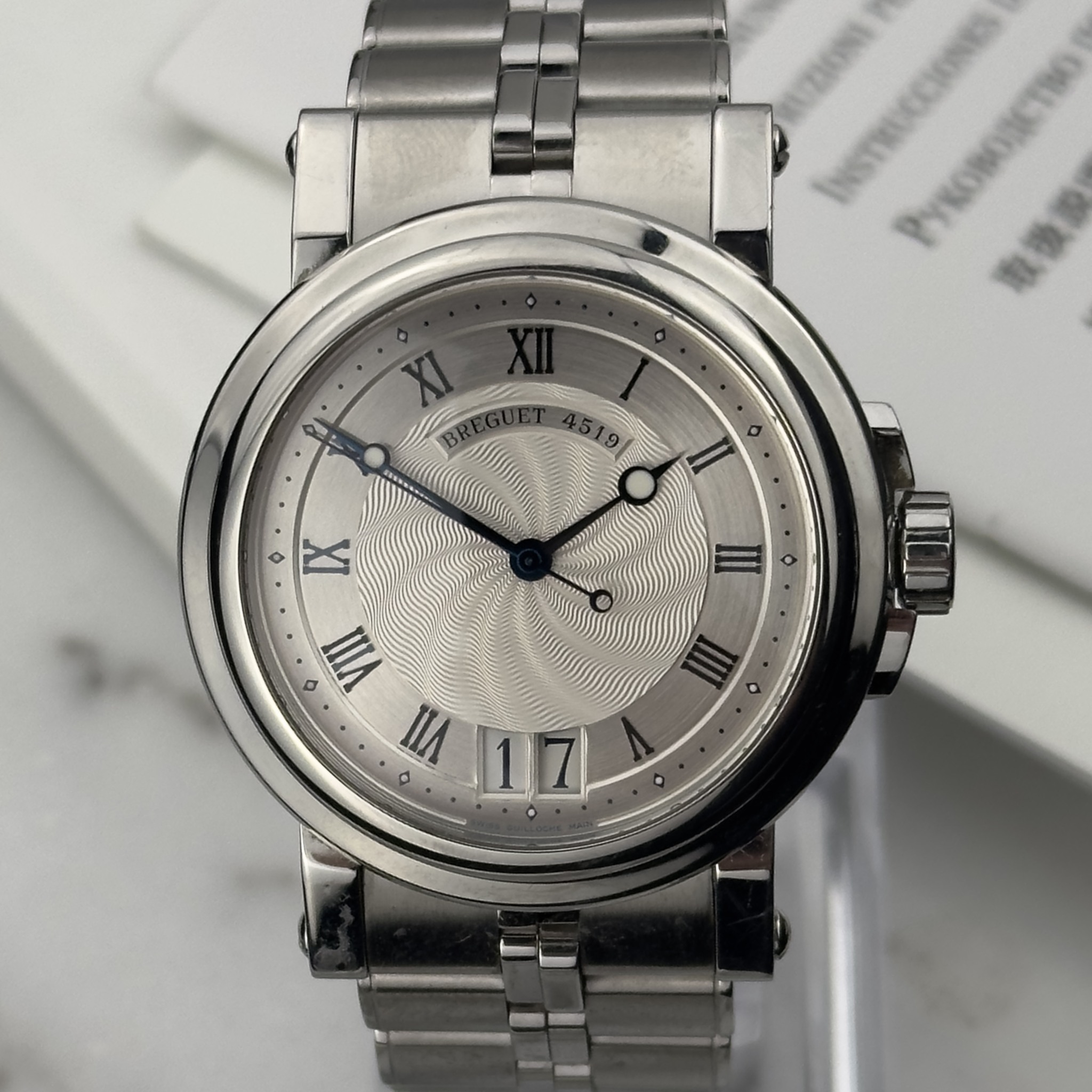 May be an image of wrist watch and text