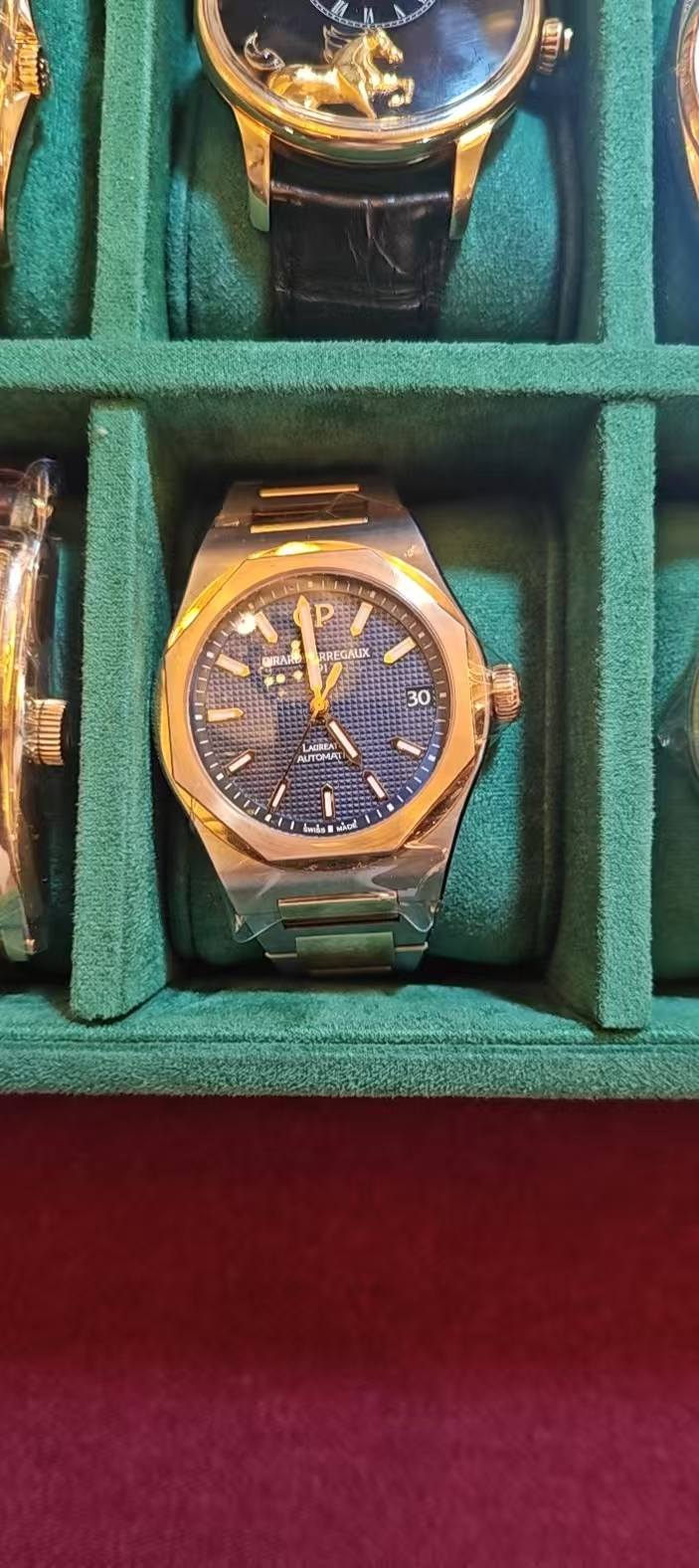 May be an image of wrist watch and text