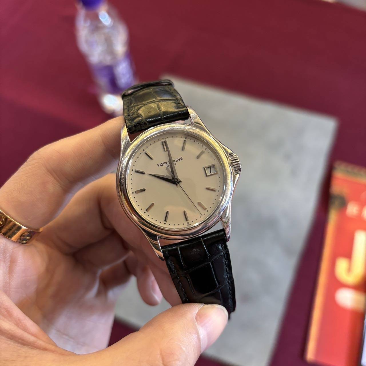 May be an image of wrist watch and text that says 'Lアも ዎቴ PATEK N /'