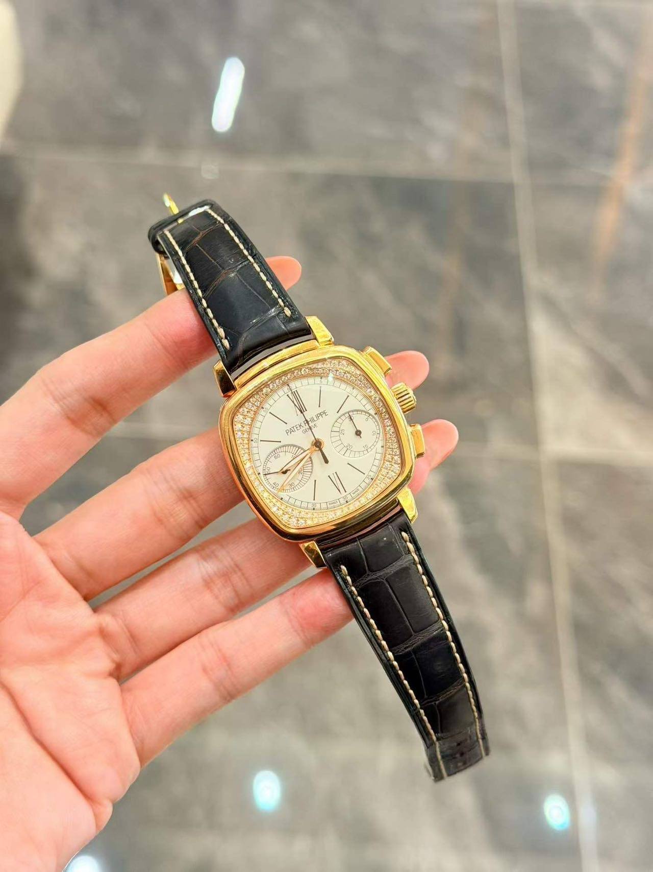 May be an image of wrist watch and text