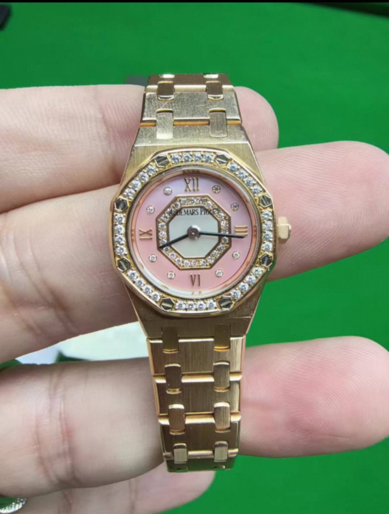 May be an image of wrist watch and text