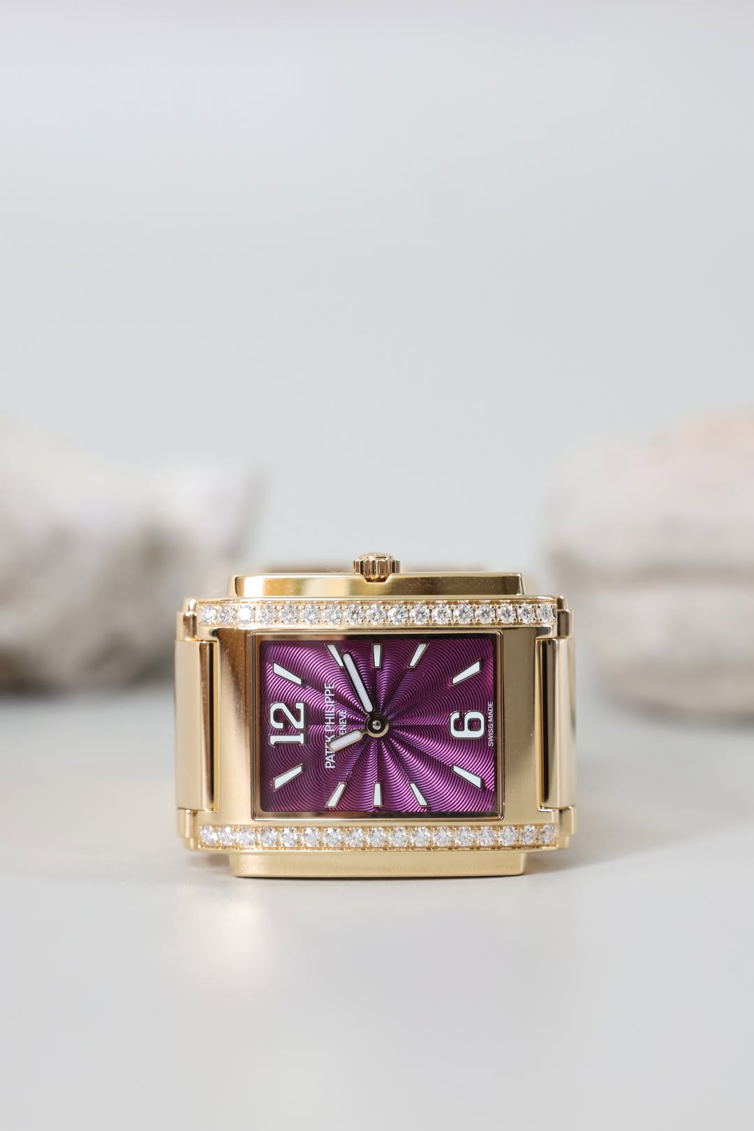 May be an image of wrist watch, jewelry and text