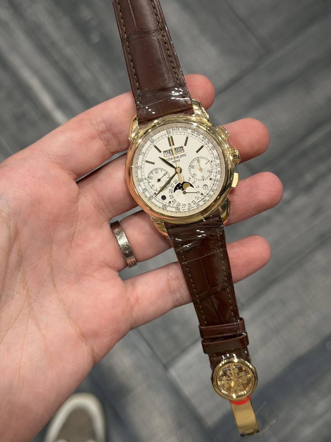 May be an image of wrist watch and text