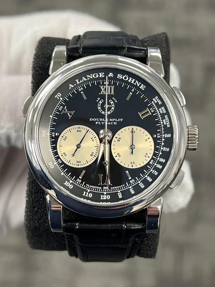 May be an image of wrist watch and text that says 'A .LANGE & SOHNE 70 50 DOUBL SPLIT ACK 80 60 50 II 10 O 25 5 S 9 OF 06 OF O a5 O nEEETИE GLARMOTTE וה τr '