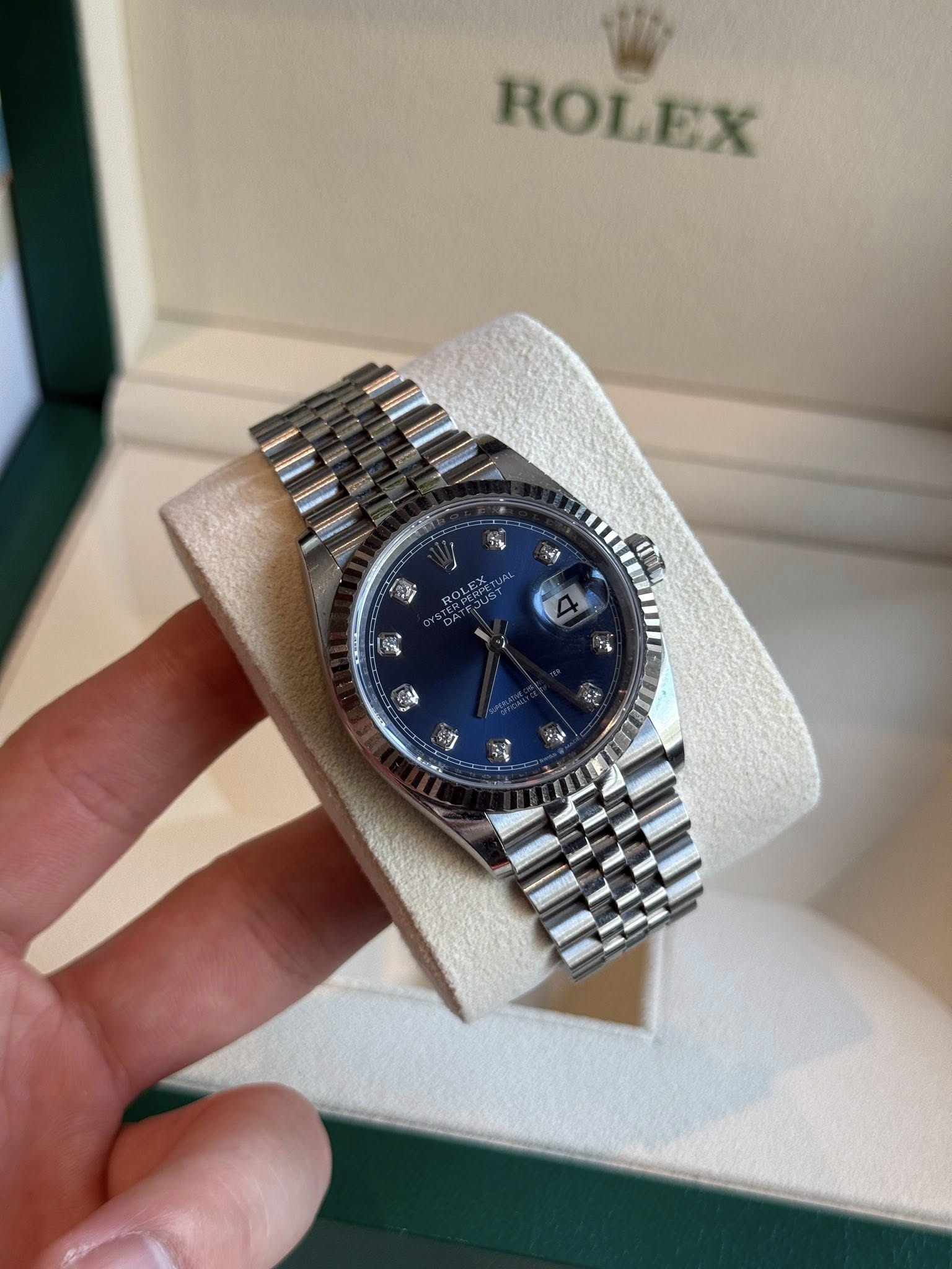 May be an image of wrist watch and text that says 'ROLEX ยน'