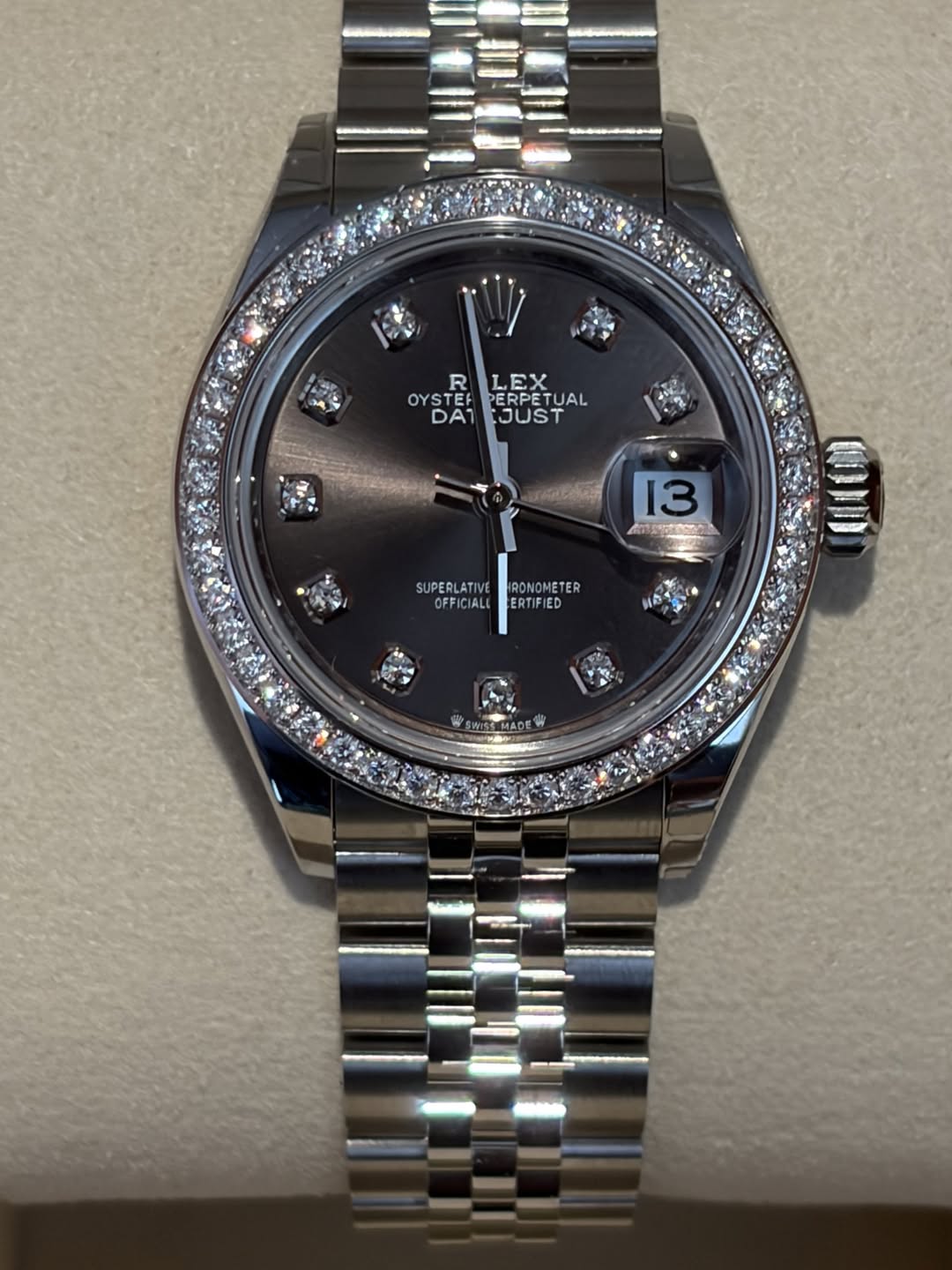 May be an image of wrist watch and text