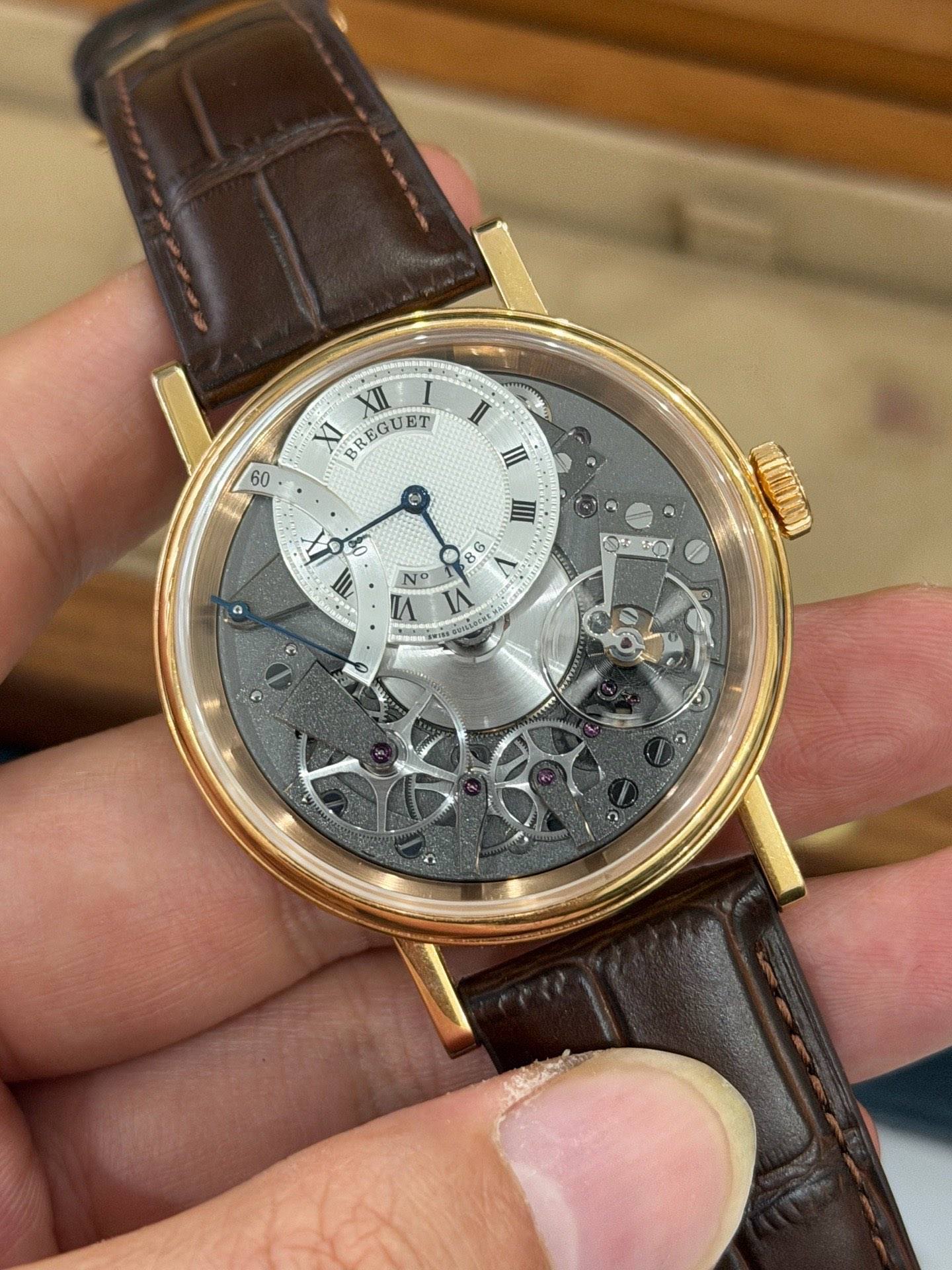 May be an image of wrist watch and text that says 'XII I XI BREGUET 60 II III S II ۷ N IA あな あさまう NO ه'