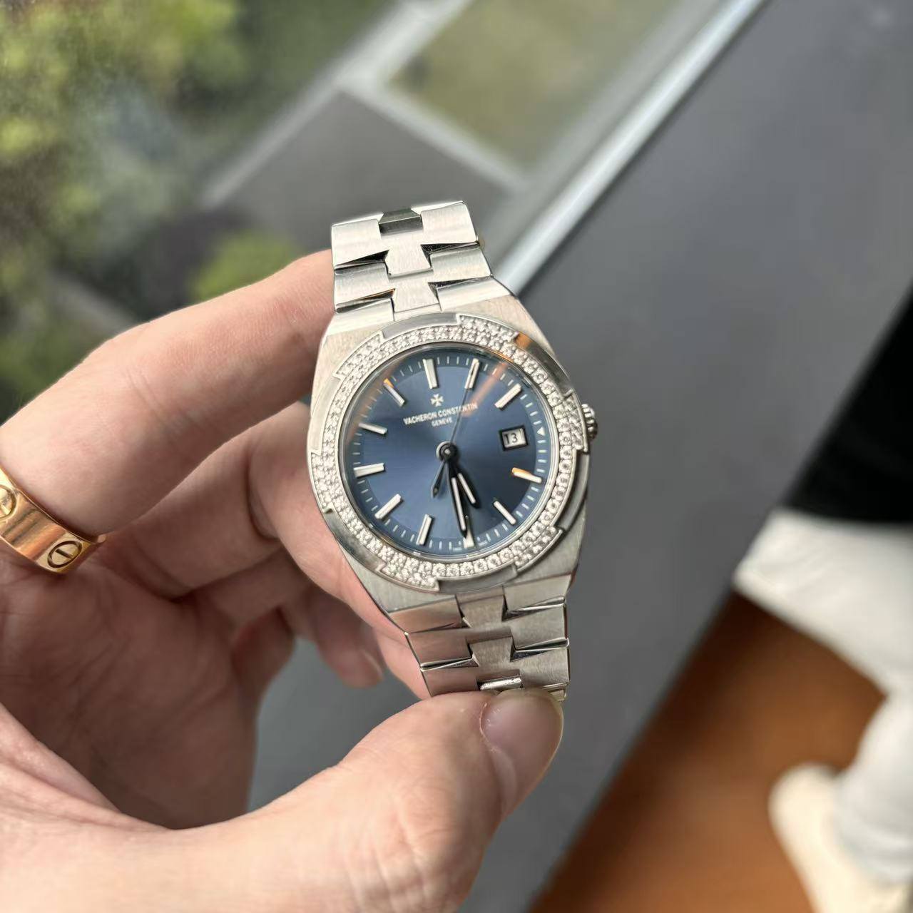 May be an image of wrist watch and text