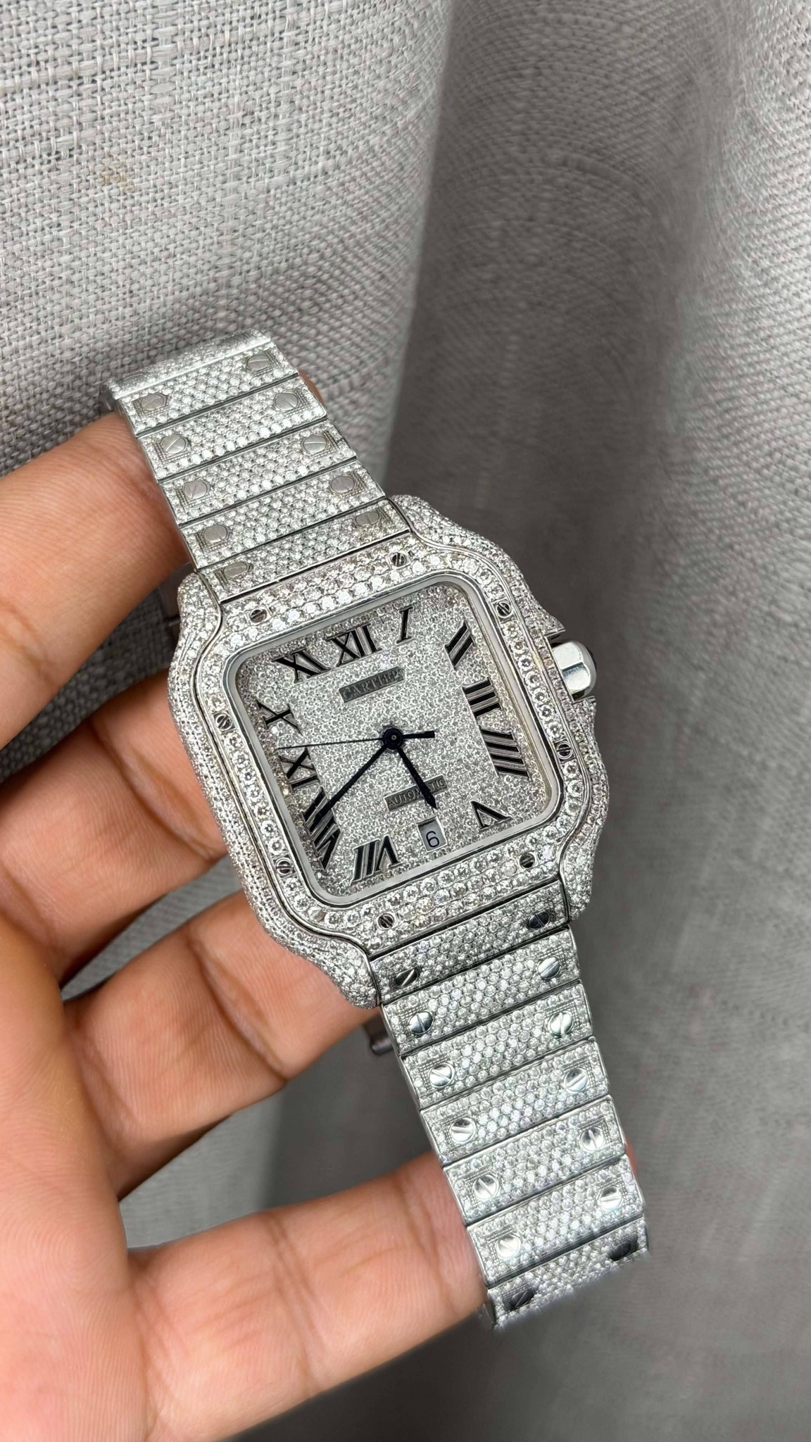May be an image of wrist watch and text