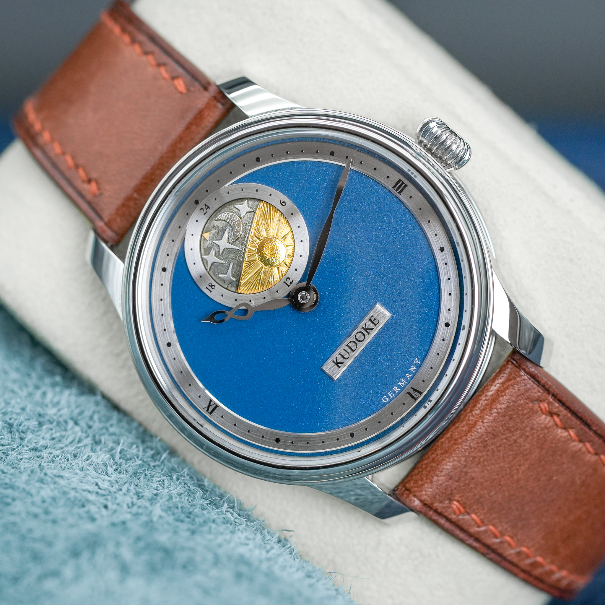 May be an image of wrist watch and text that says '24 A KUDOKE GERMAN GER'