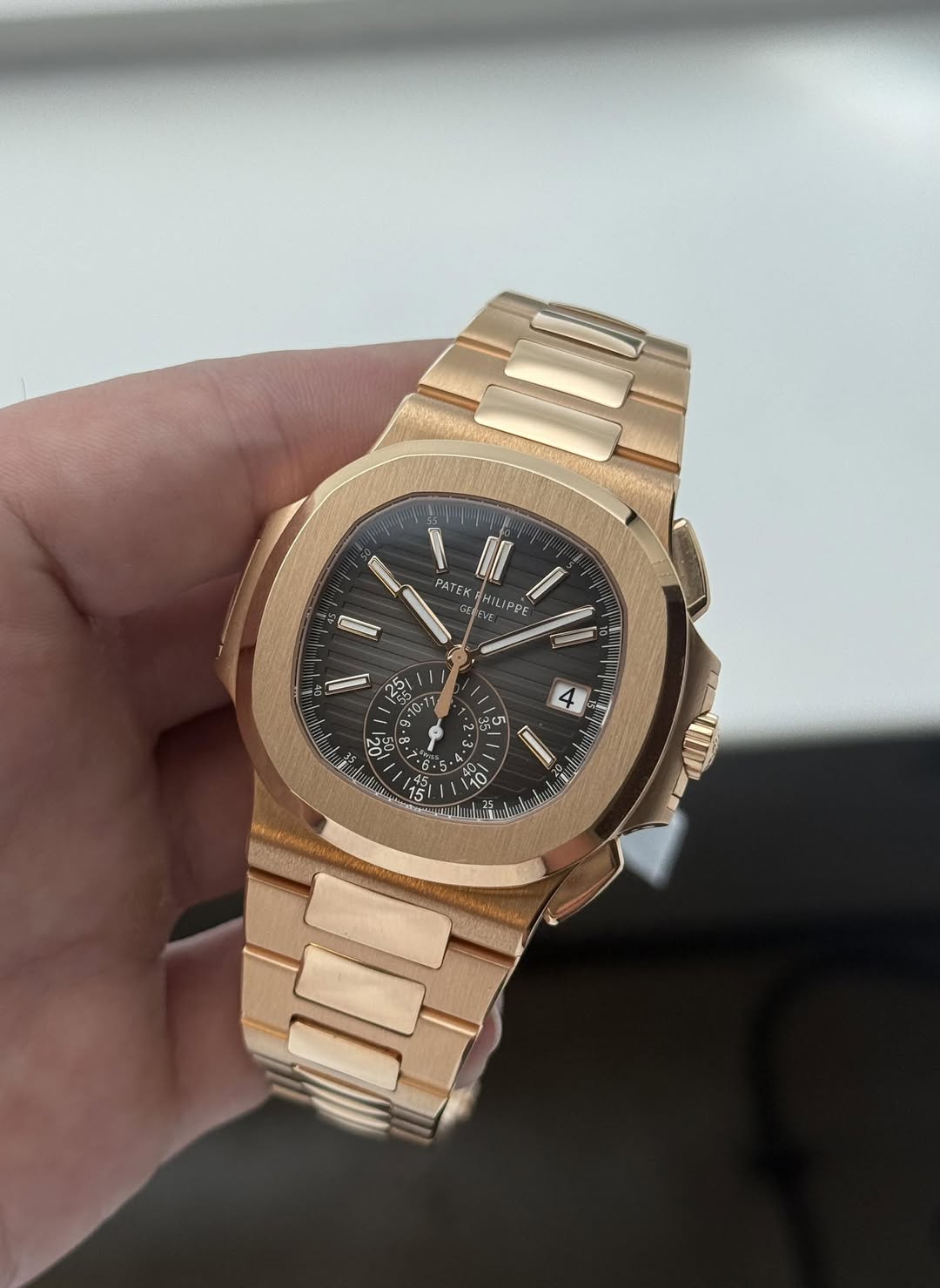 May be an image of wrist watch and text