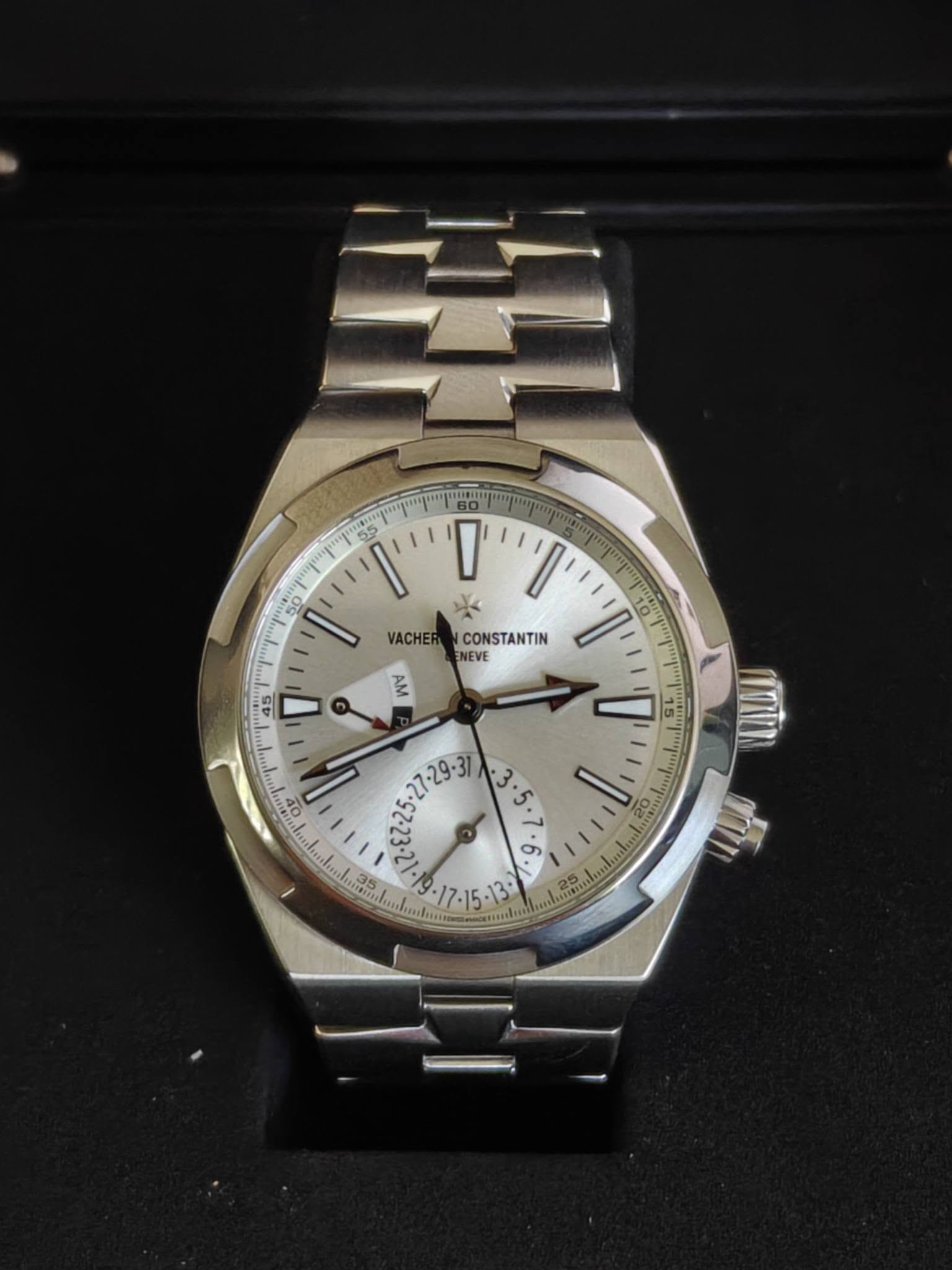 May be an image of wrist watch and text