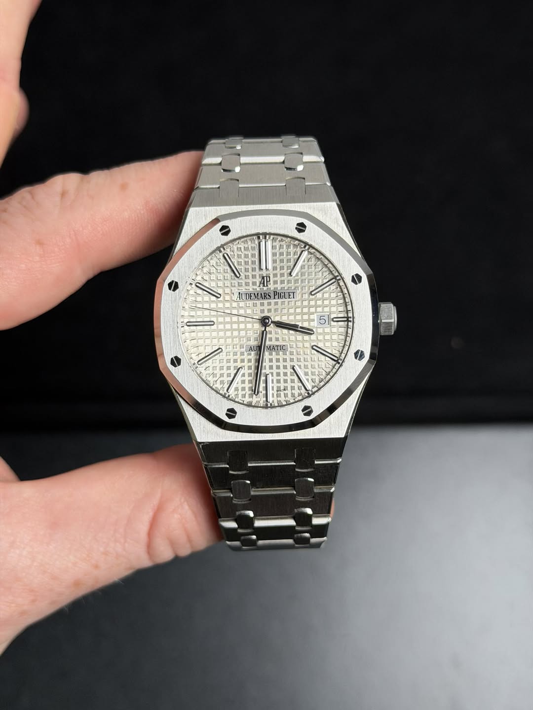 May be an image of wrist watch and text