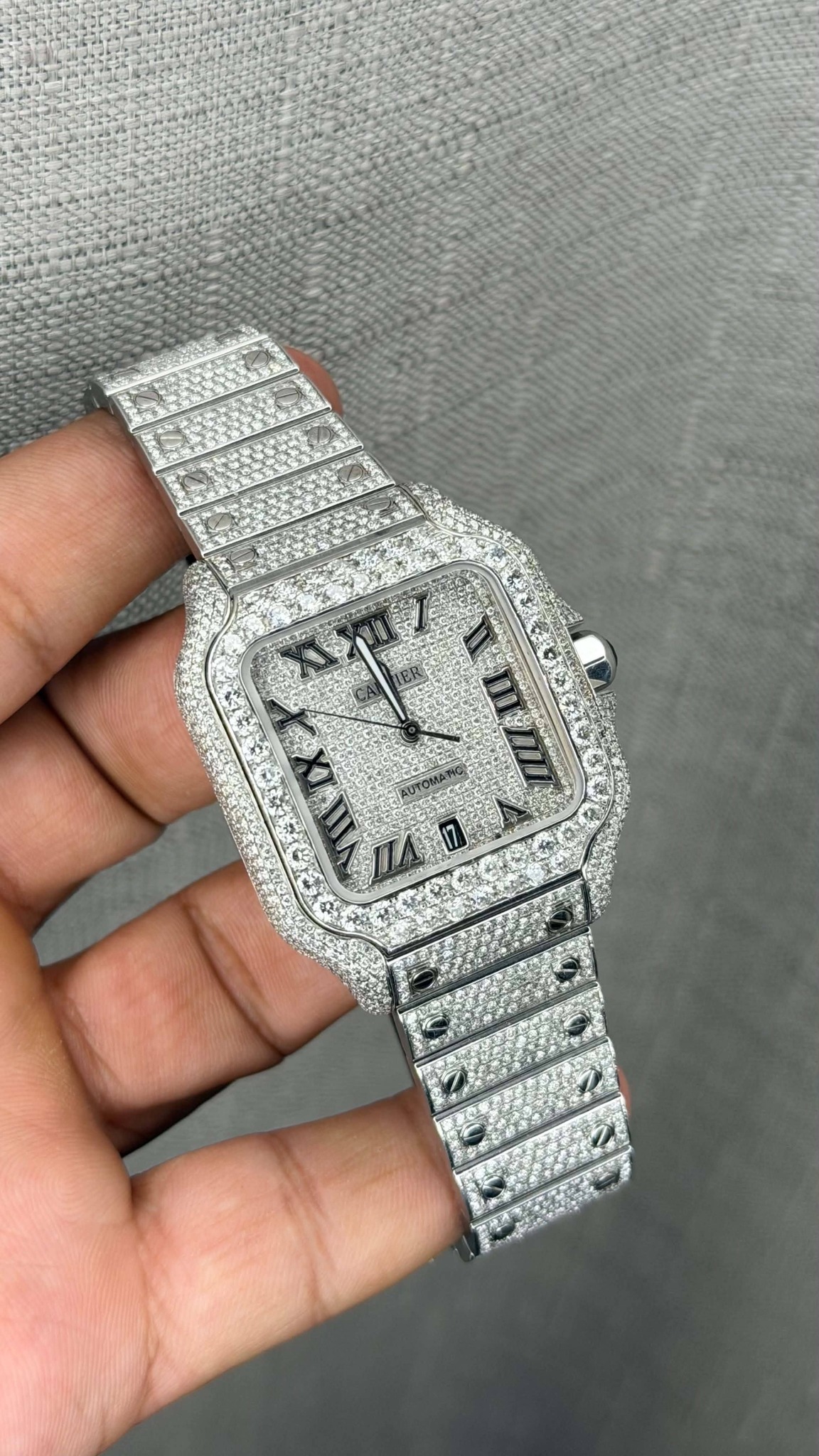 May be an image of wrist watch and text