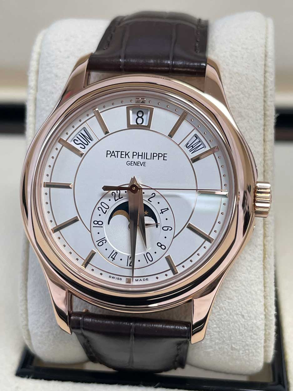 May be an image of wrist watch and text that says '18| SUN PATEK PHILIPPE GENEVE ٥ 8 91 ك 8 10 8 a 4 ® SWISS 1 MADE .か..さな'