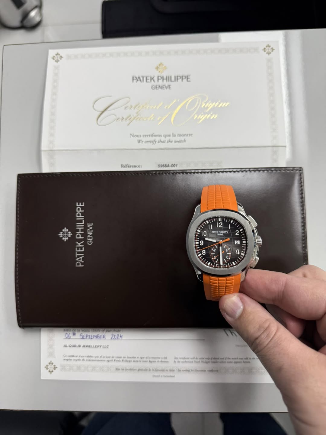 May be an image of wrist watch and text