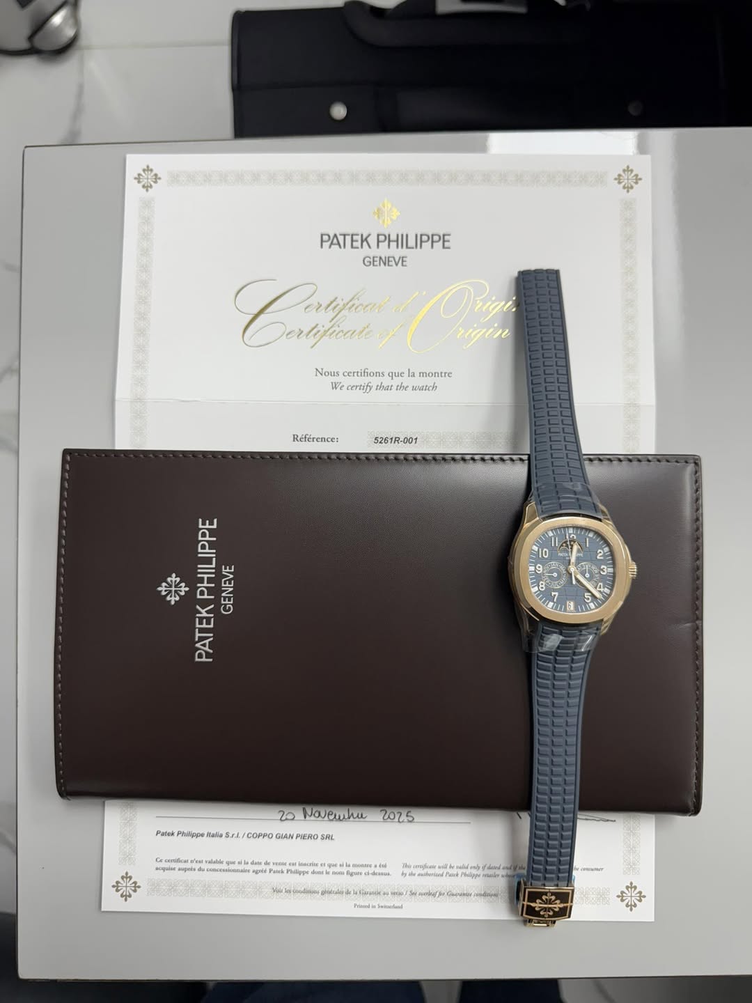 May be an image of wrist watch, saddle-stitched leather and text