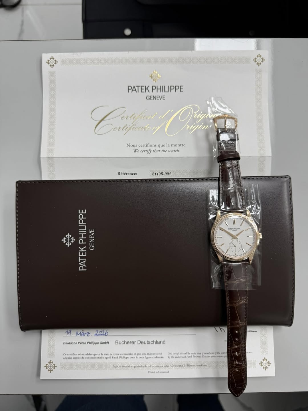 May be an image of wrist watch and text
