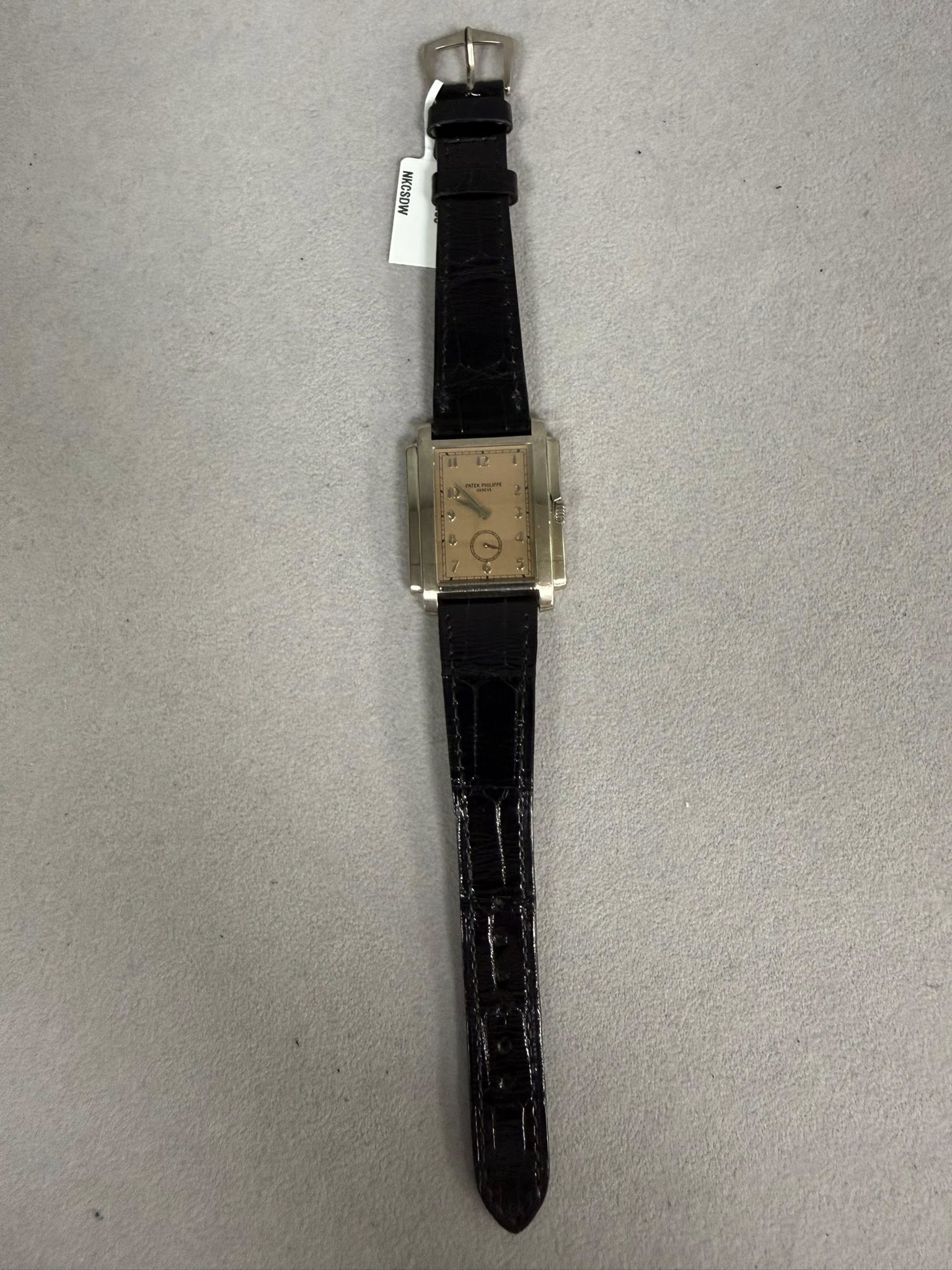 May be an image of leather, digital watch and text