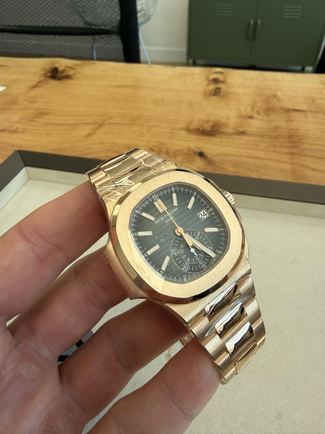 May be an image of wrist watch and text