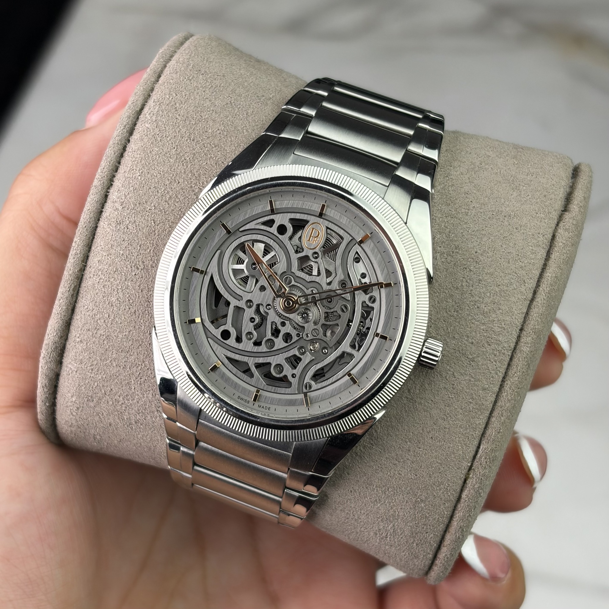 May be an image of wrist watch and text