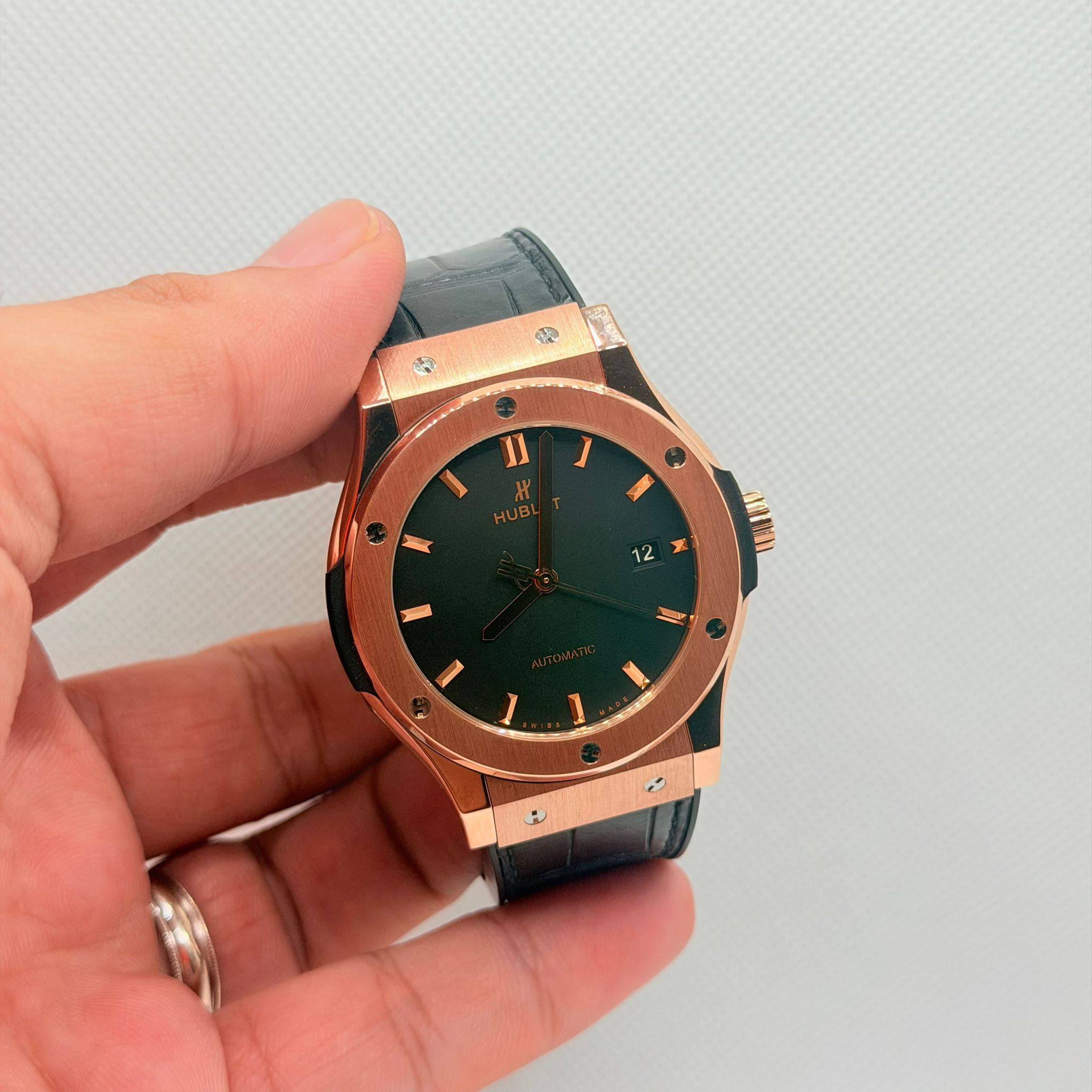 May be an image of wrist watch and text
