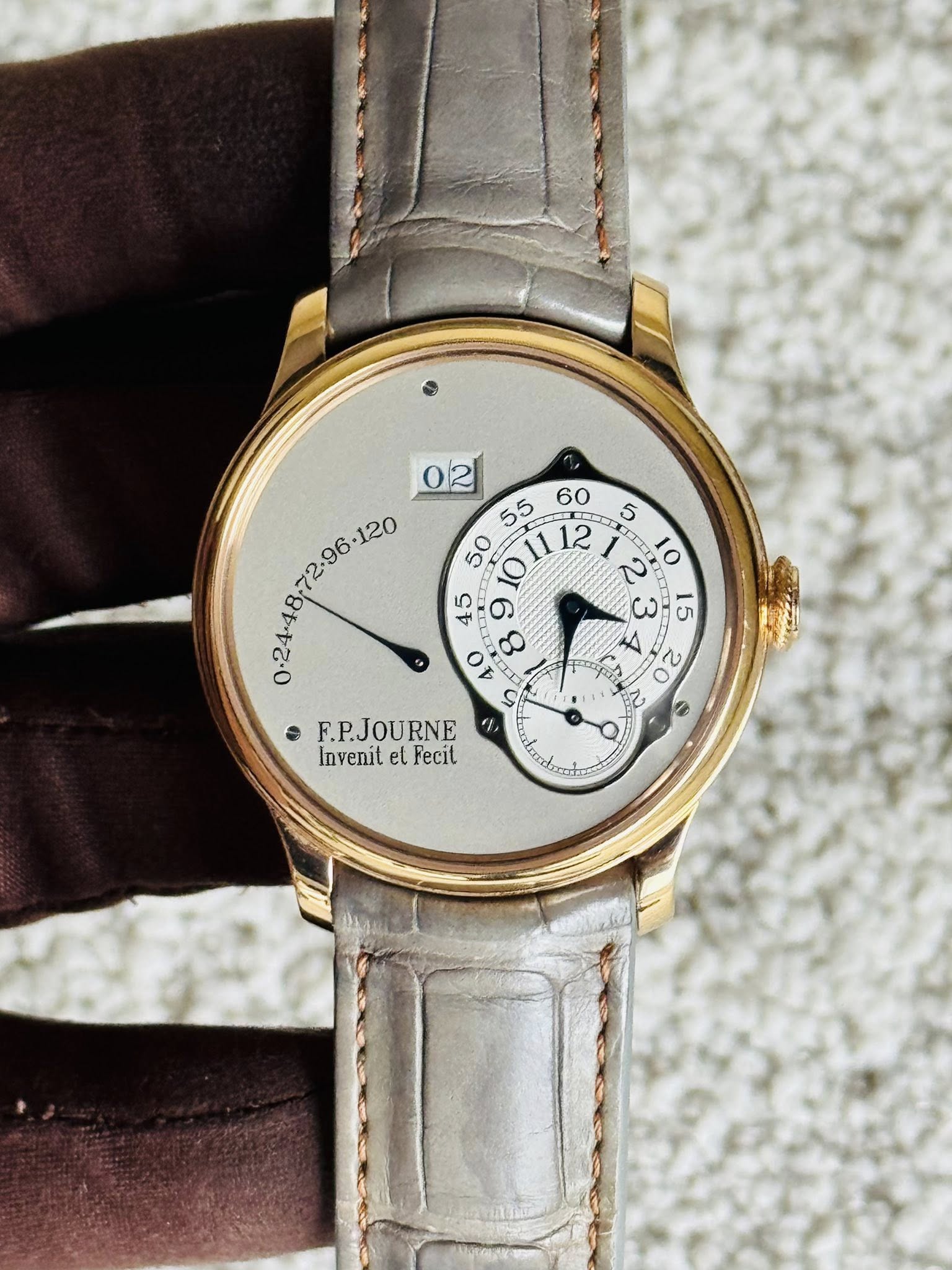 May be an image of wrist watch and text
