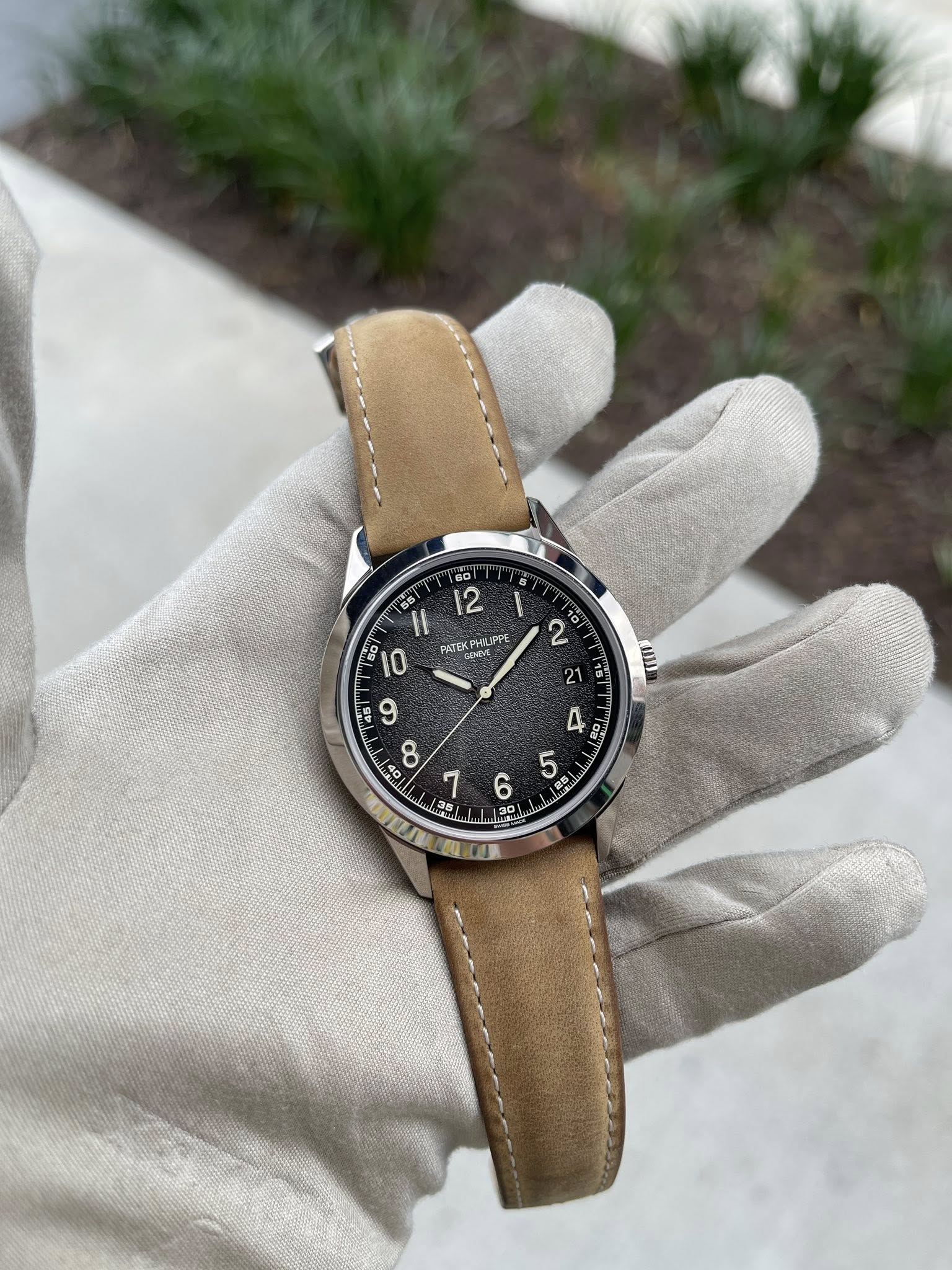 May be an image of wrist watch and text that says '55 00 12 PATEK PHILIFPE ቢሆየ GINME B0 0 I 2 21 없 : โซ 7 35 E 00'