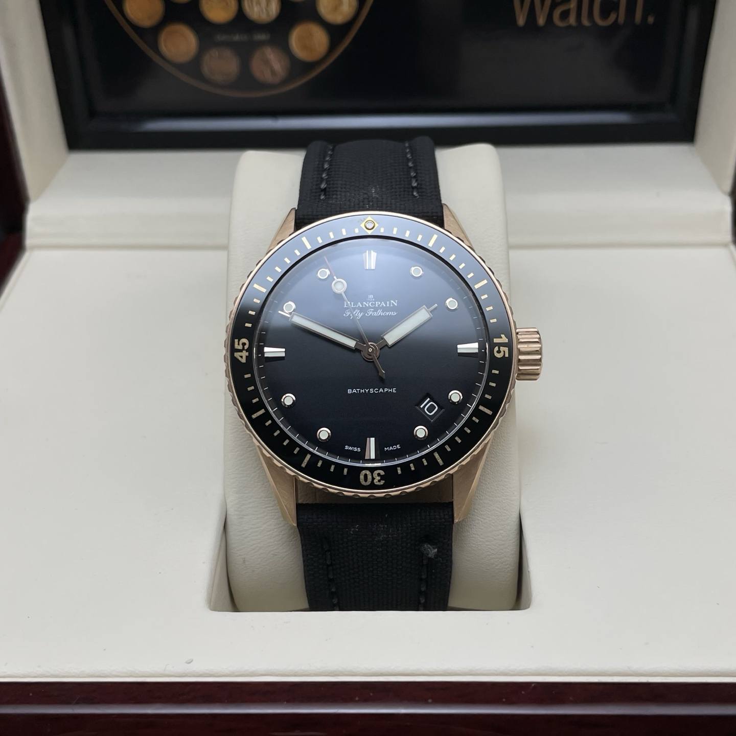 May be an image of wrist watch and text