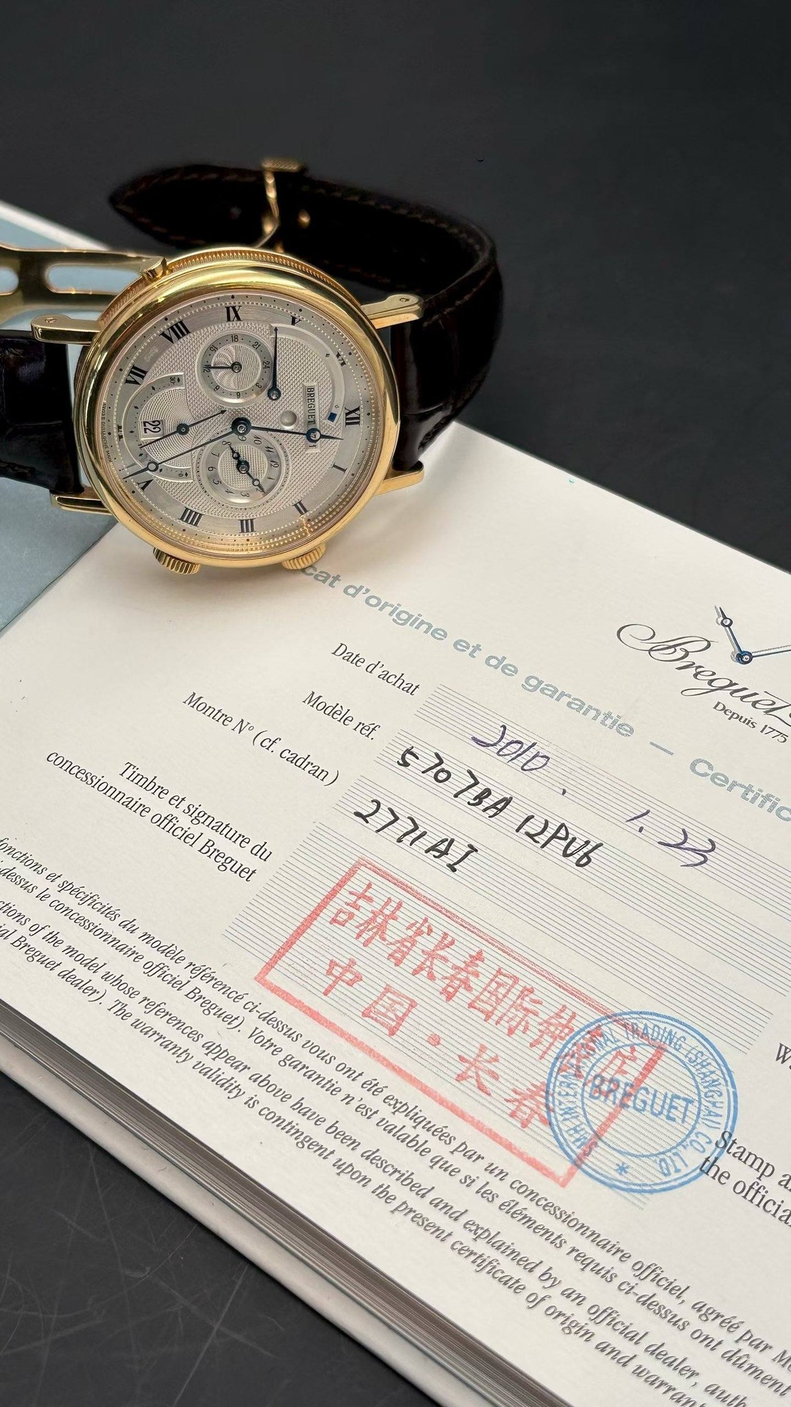 May be an image of wrist watch and text that says 'TRESUEL I TII 4TOH mcat at d'origine Date et de l'achat Montre Modele rét. epius concessionnaire (cf. Timbre cadran Certific…