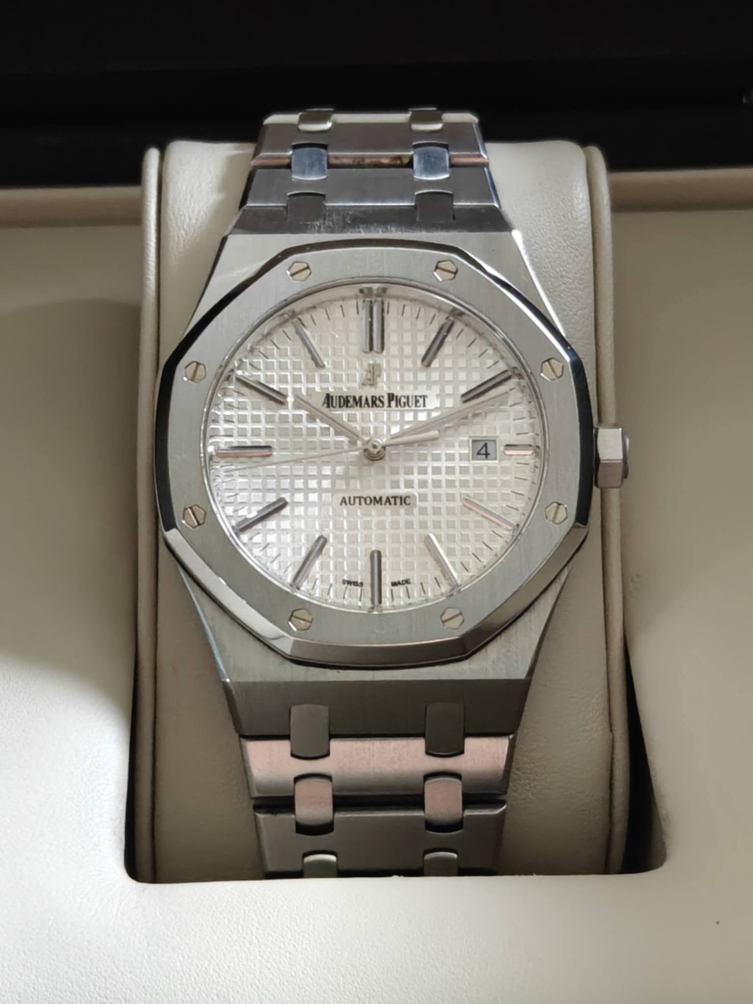 May be an image of wrist watch and text