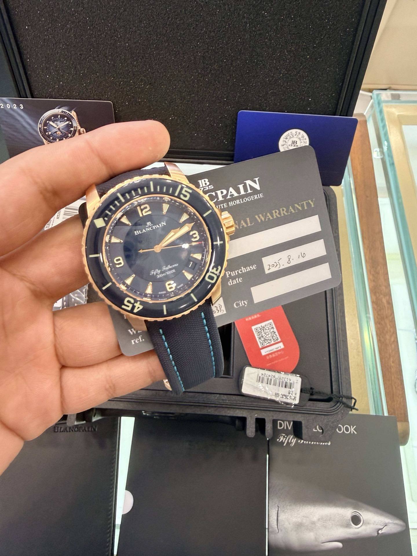 May be an image of wrist watch and text