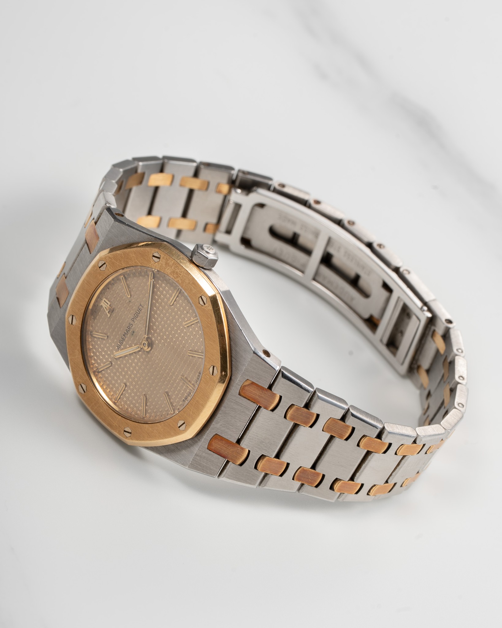 May be an image of wrist watch, jewelry and text