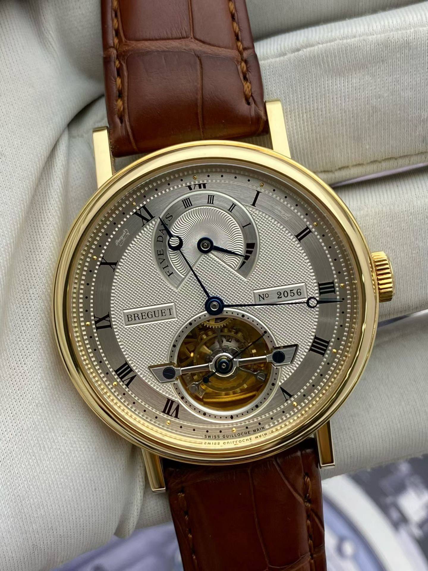 May be an image of wrist watch and text that says 'III II II A BREGUET N2056 NO 2056 SW155 พยาท 26.108 OCHE'