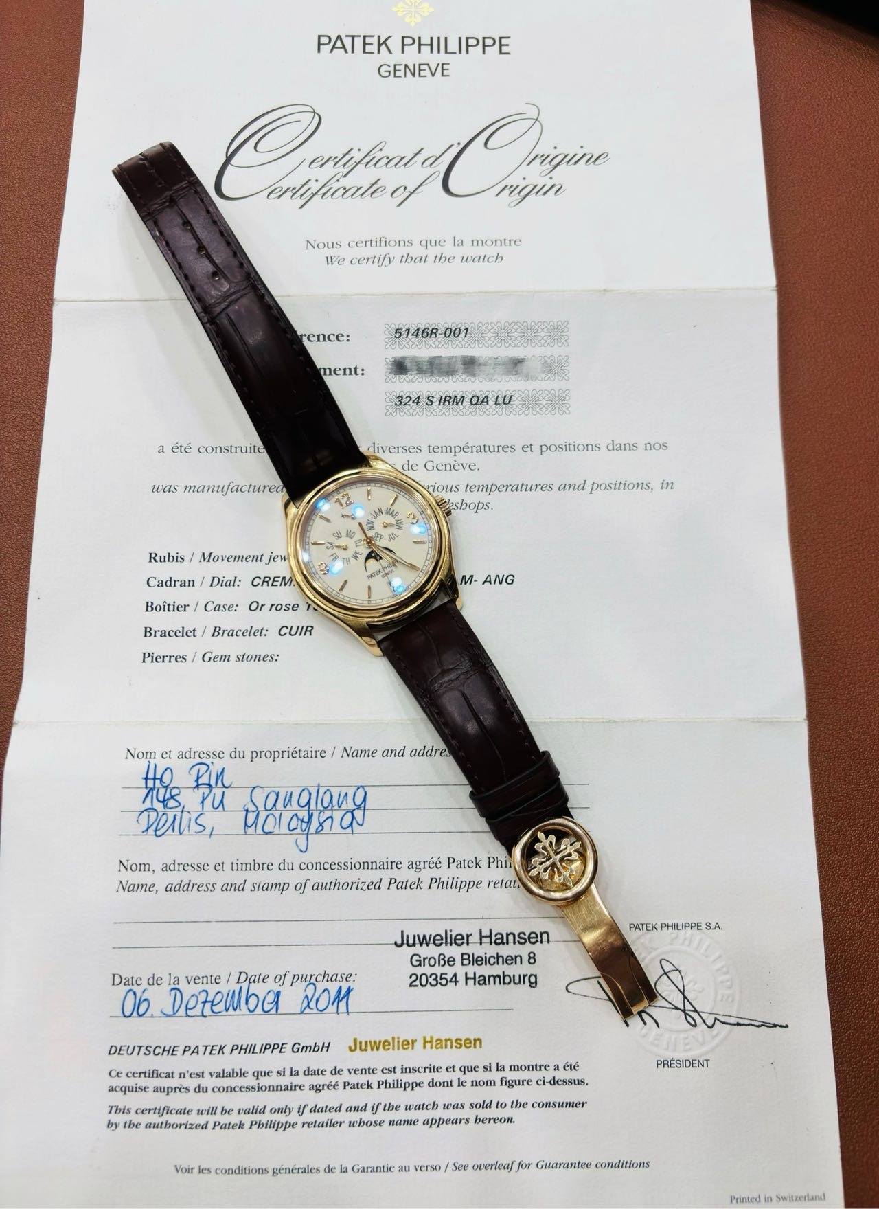 May be an image of wrist watch and text that says 'PATEK PHILIPPE GENEVE Csafig Chiên ngin Nous certifions que montre Hbly that the waich rence: 5146R-001 ment: été construite was…