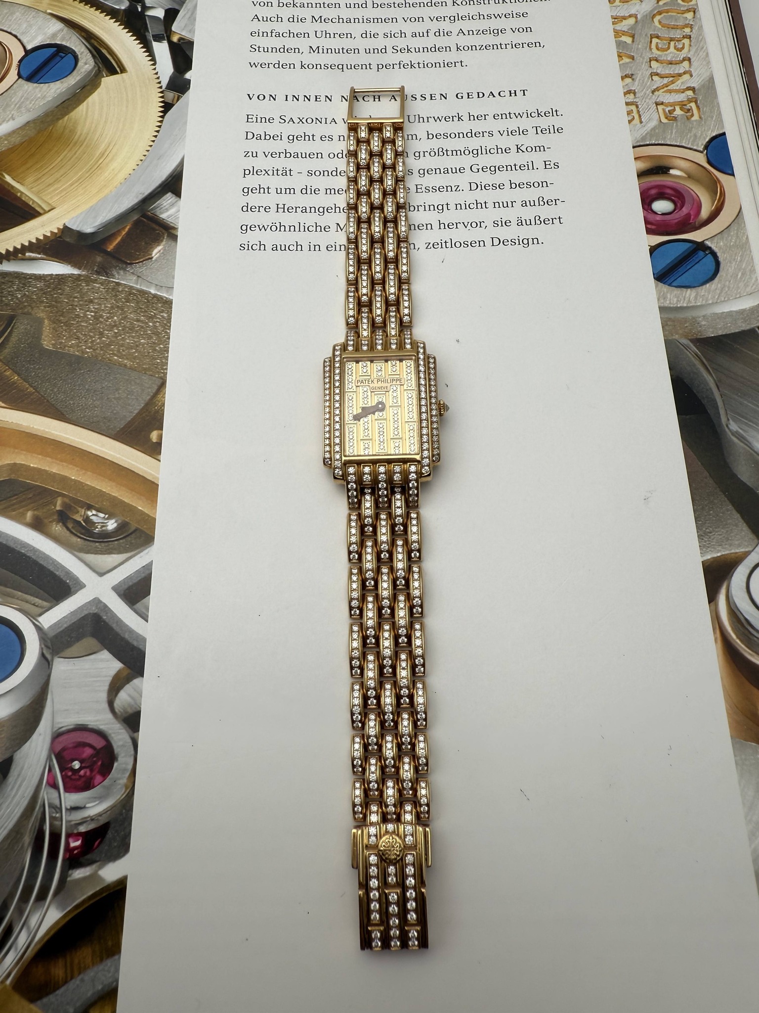May be an image of wrist watch, jewelry and text