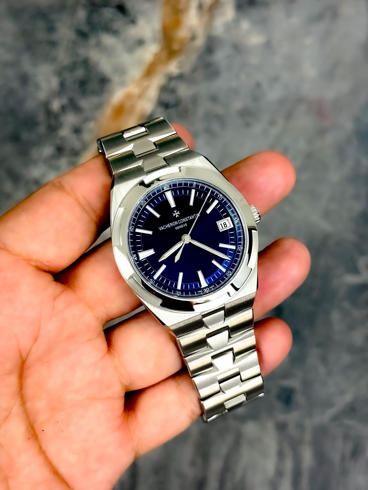 May be an image of wrist watch and text