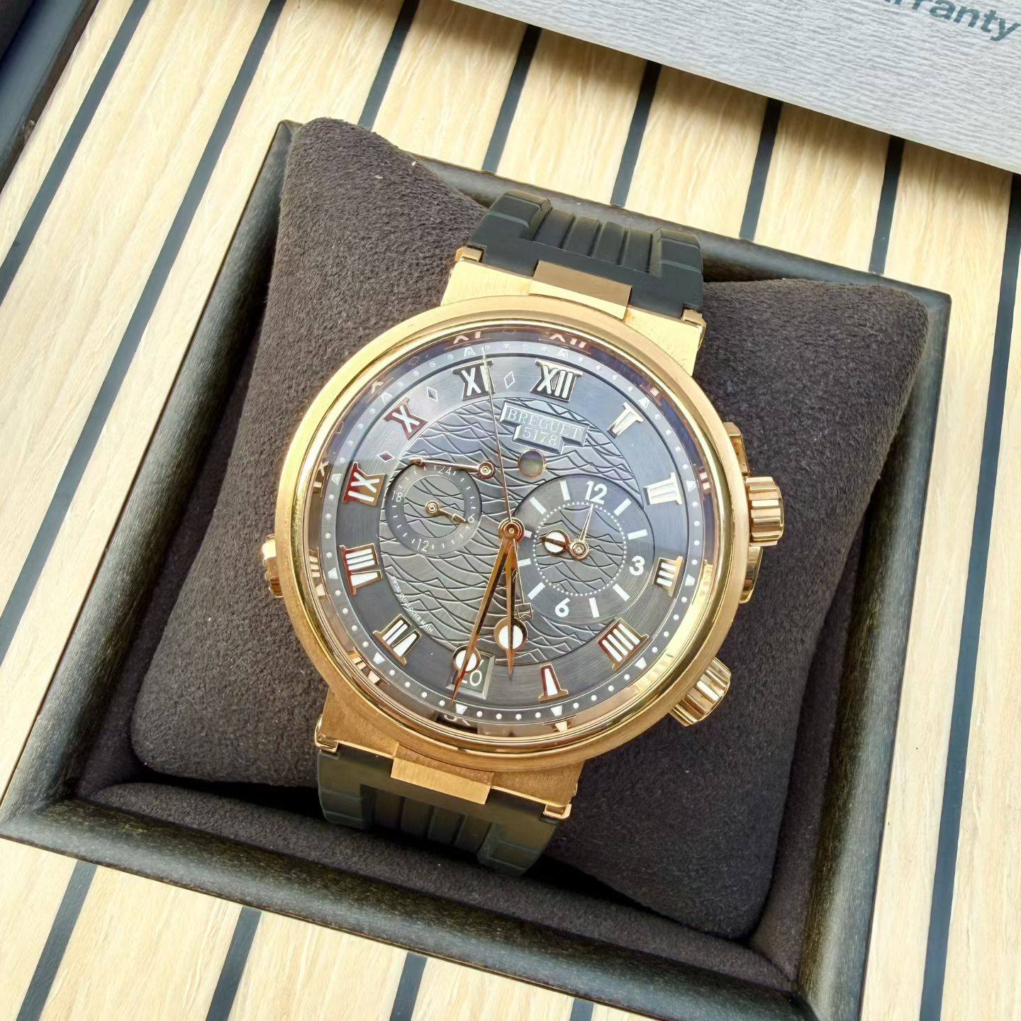 May be an image of wrist watch and text