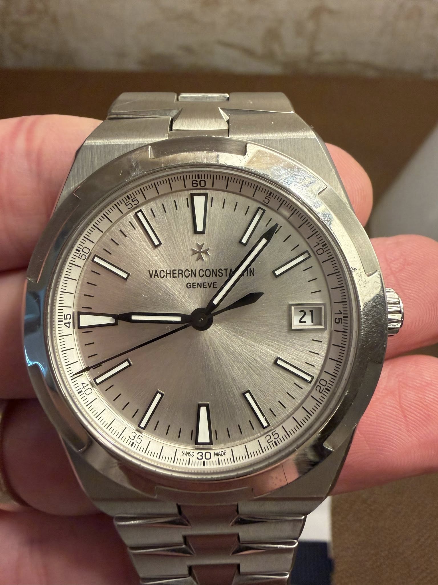 May be an image of wrist watch and text