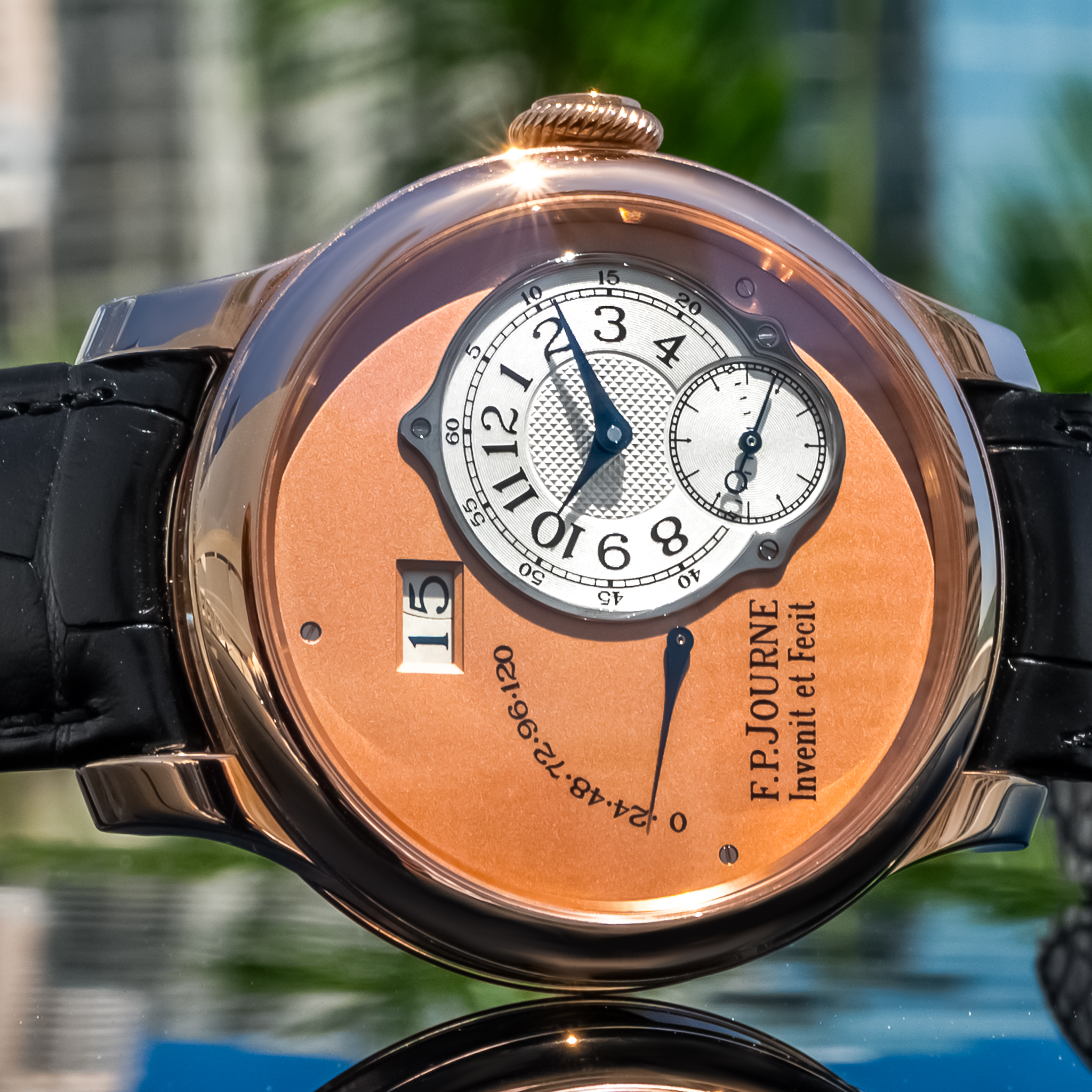 May be an image of wrist watch and text