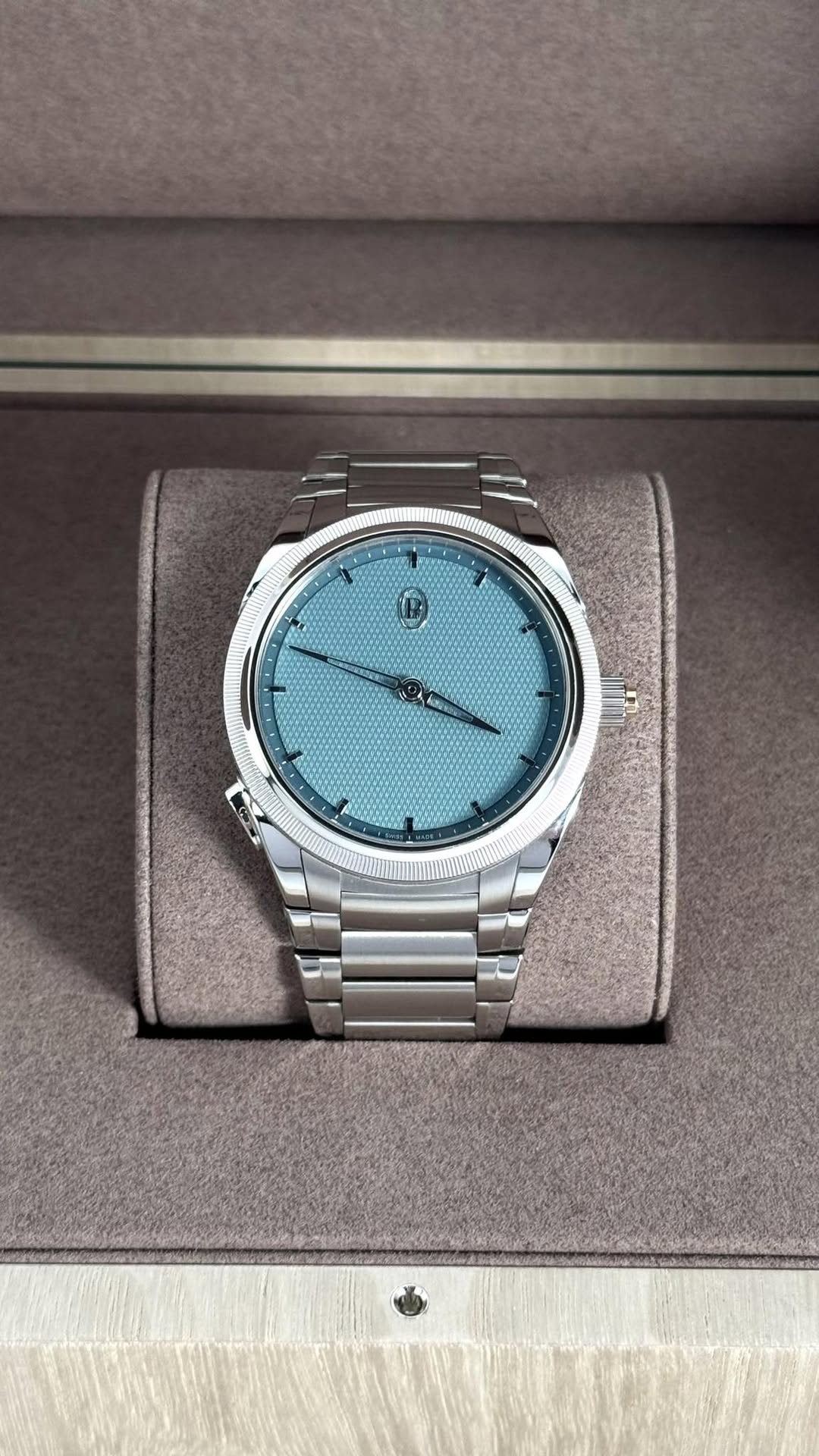 May be an image of wrist watch and text