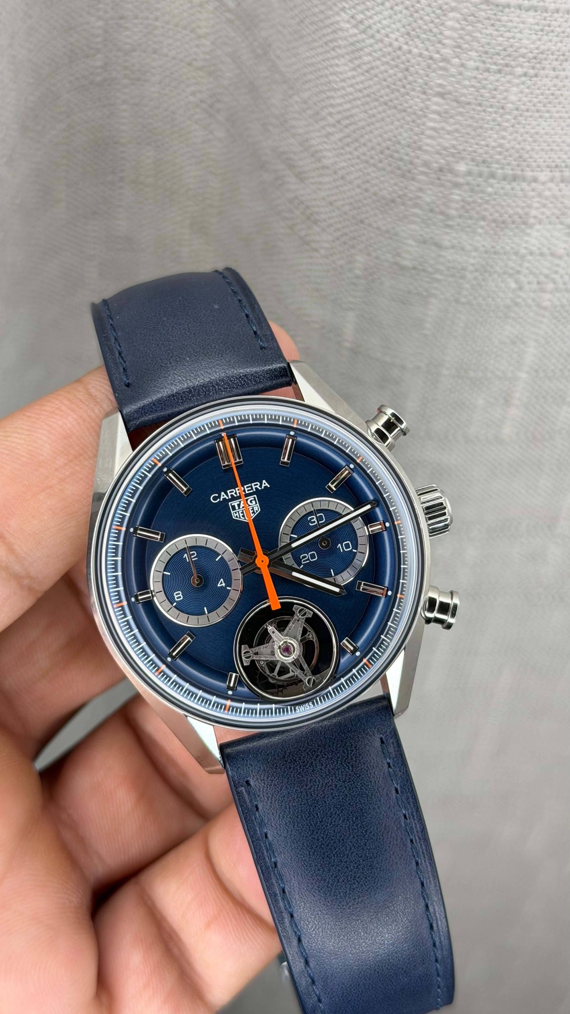May be an image of wrist watch and text