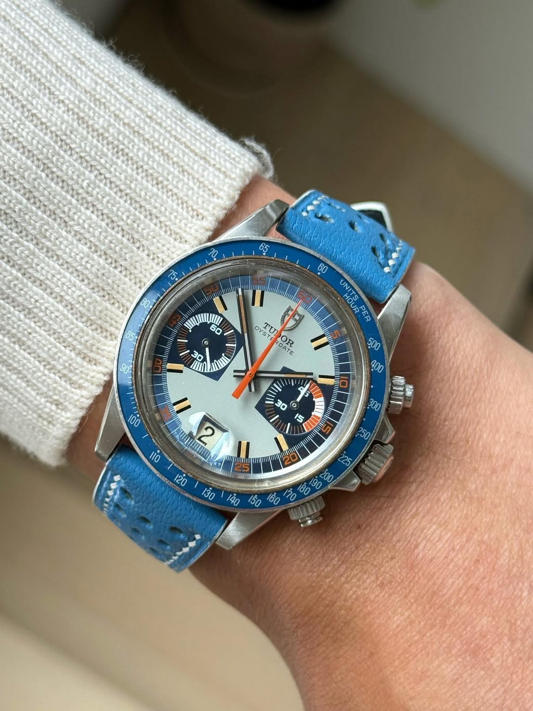 May be an image of wrist watch and text