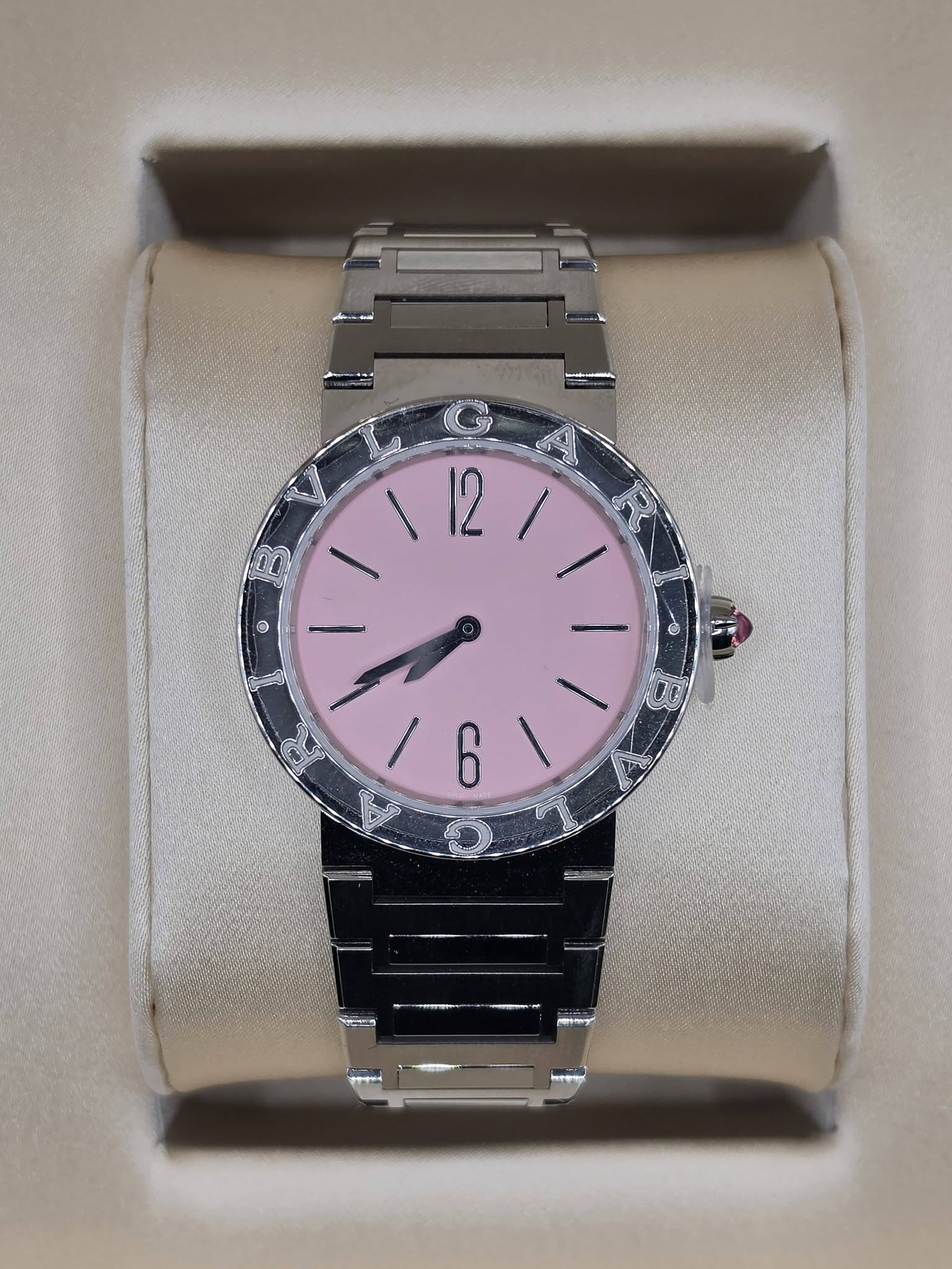May be an image of wrist watch and text