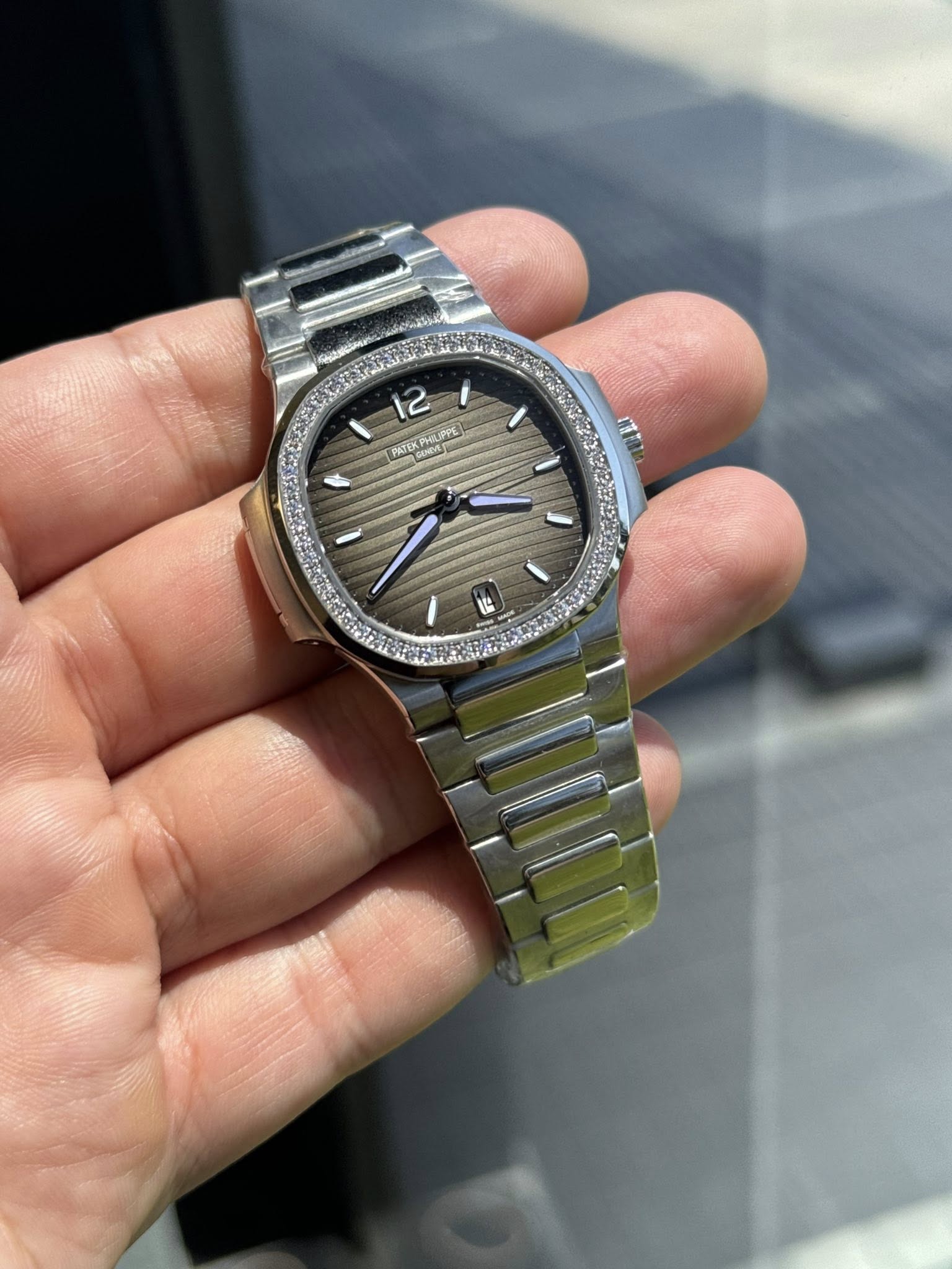 May be an image of wrist watch and text
