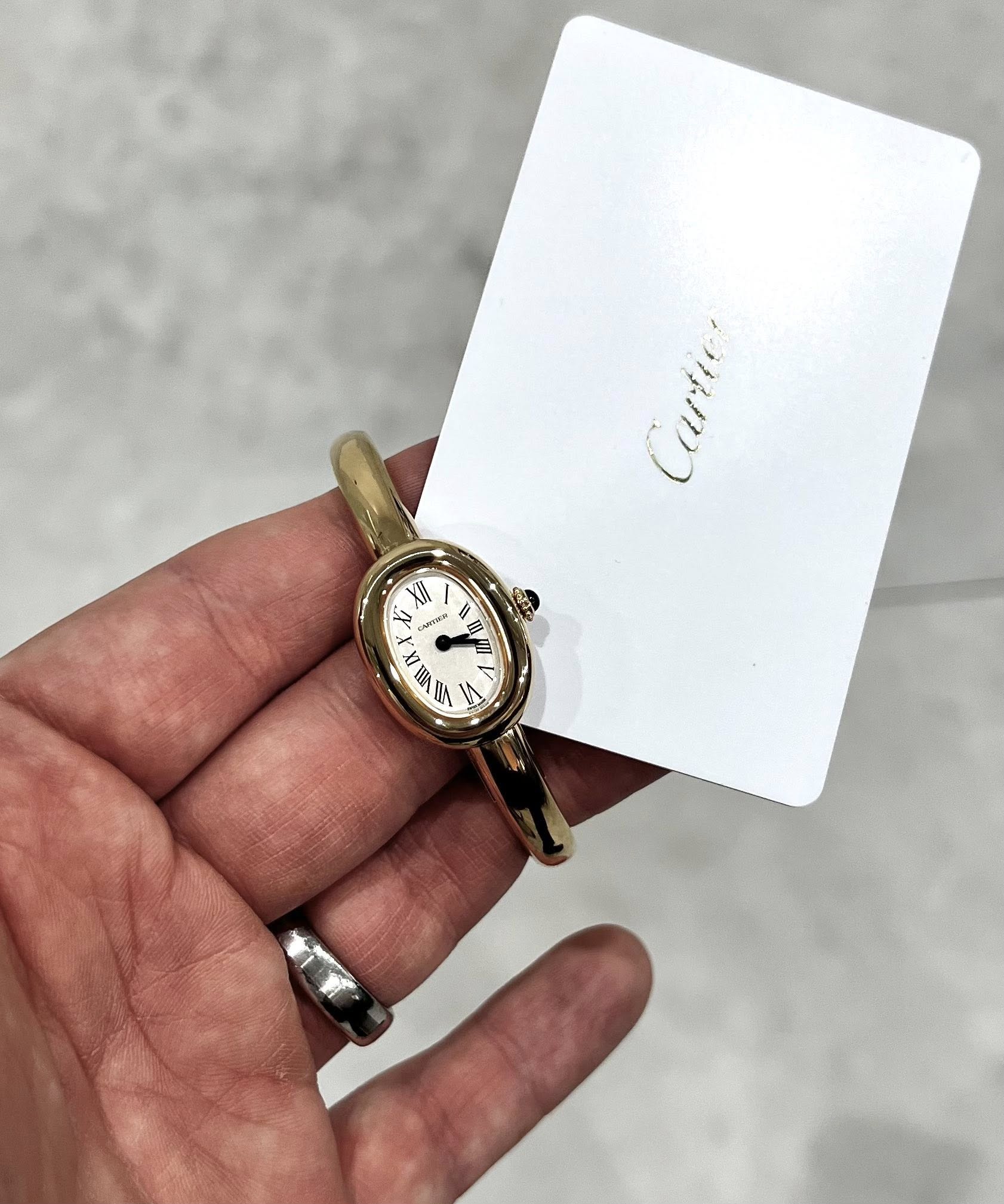 May be an image of wrist watch and text