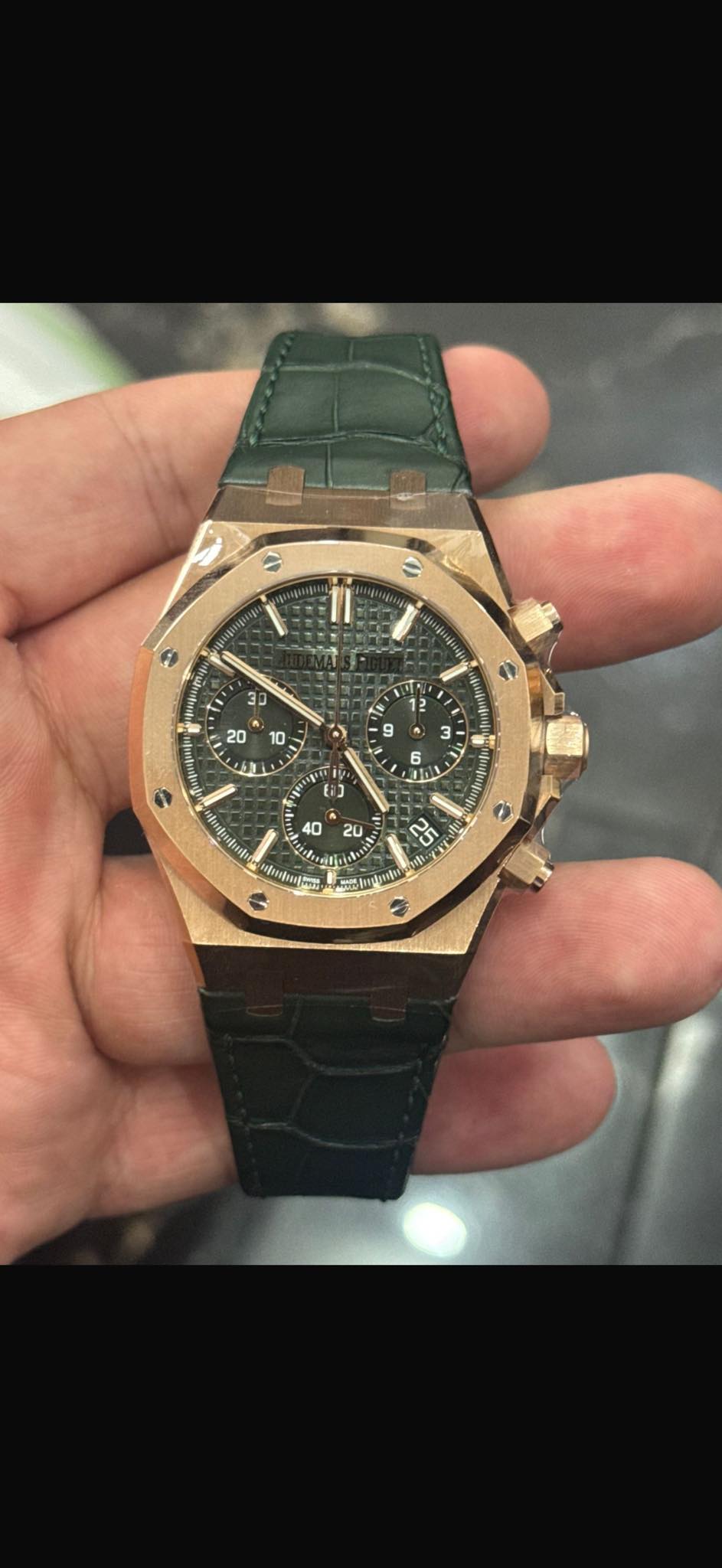 May be an image of wrist watch and text