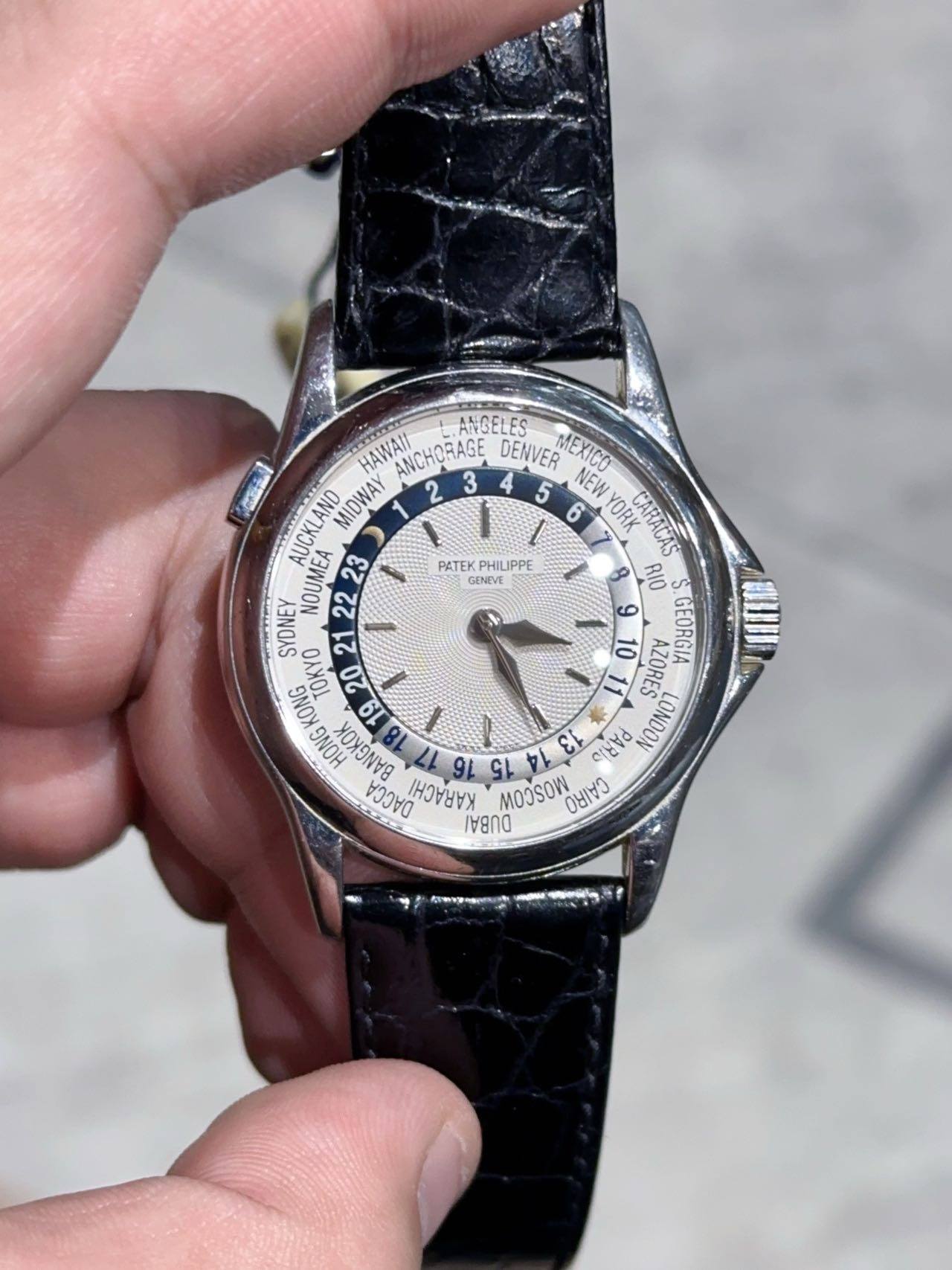 May be an image of wrist watch and text